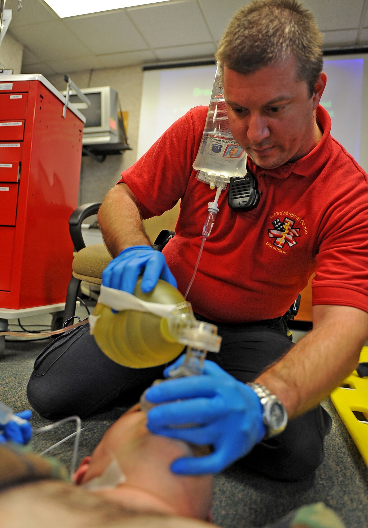 LANGLEY AIR FORCE BASE, Va. -- Paul Ruppert, 633d Medical Operations Squadron paramedic, maintains simulated life support for Tech. Sgt. Gary Friedman, 27th Fighter Squadron medical elements specialist, during Pre-Hospital Trauma Life Support training March 29. Paramedics undergo extensive training to ensure they are qualified to perform the duties assigned to them.  (U.S. Air Force photo/Airman Rebecca Montez)