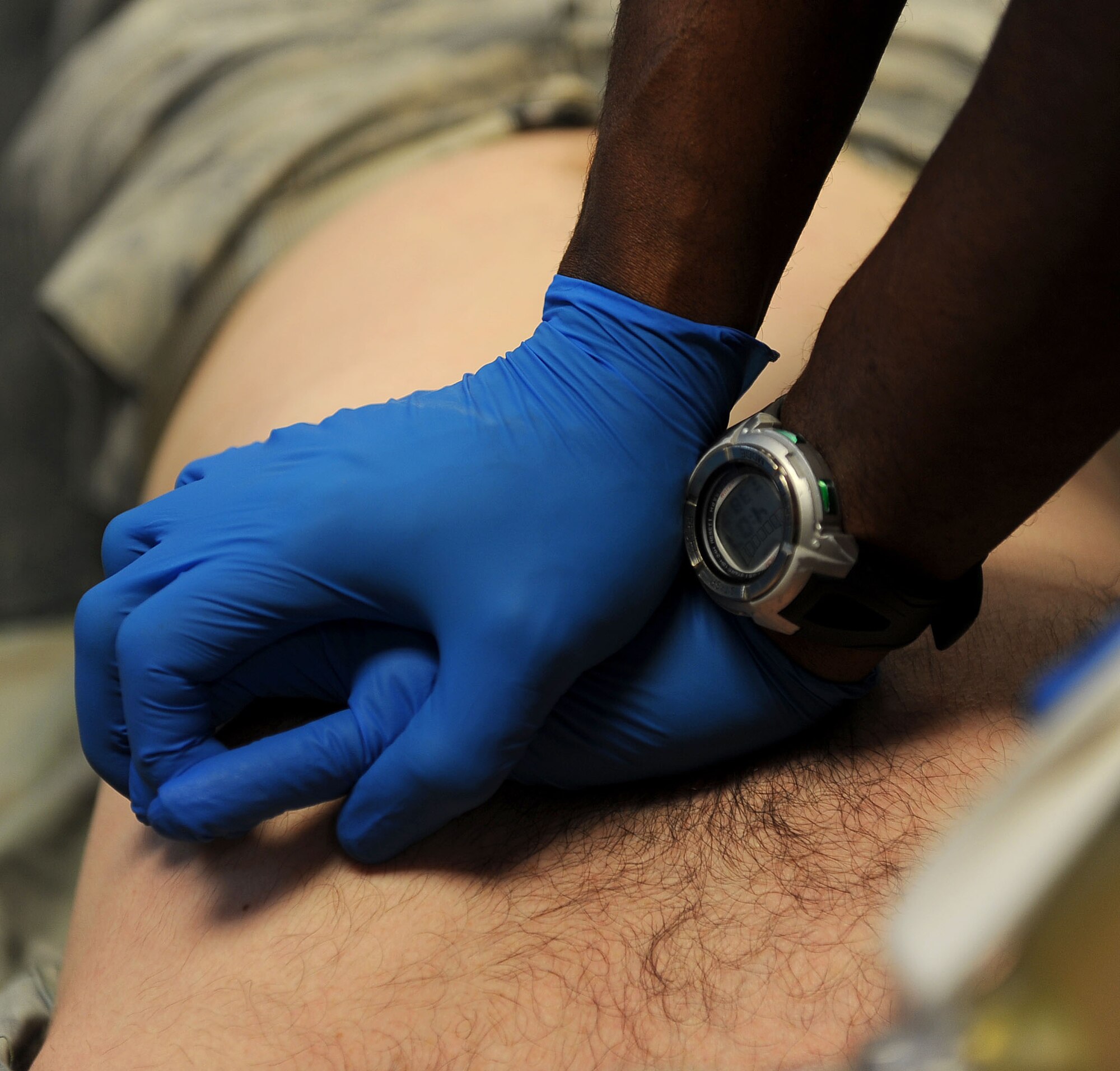 LANGLEY AIR FORCE BASE, Va. -- Elvin DeLoach, 633d Medical Operations Squadron paramedic, performs simulated chest compressions on Tech. Sgt. Gary Friedman, 27th Fighter Squadron medical elements specialist, during Pre-Hospital Trauma Life Support training March 29. Paramedics undergo extensive training to ensure they are qualified to perform the duties assigned to them. (U.S. Air Force photo/Airman Rebecca Montez)