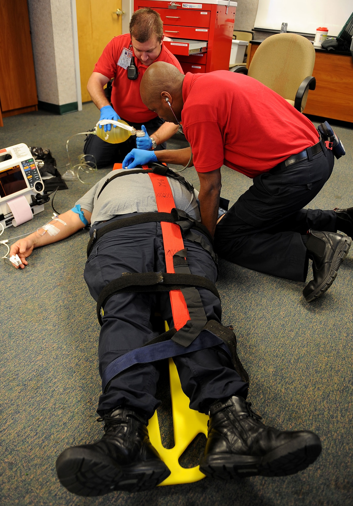 LANGLEY AIR FORCE BASE, Va. -- Paul Rupert and Elvin DeLoach, 633 Medical Operations Squadron paramedics, simulate an incubation on David Ezzell Jr., 633d MDOS paramedic, during Pre-Hospital Trauma Life Support training March 29. Paramedics undergo extensive training to ensure they are qualified to perform the duties assigned to them.  (U.S. Air Force photo/Airman Rebecca Montez)