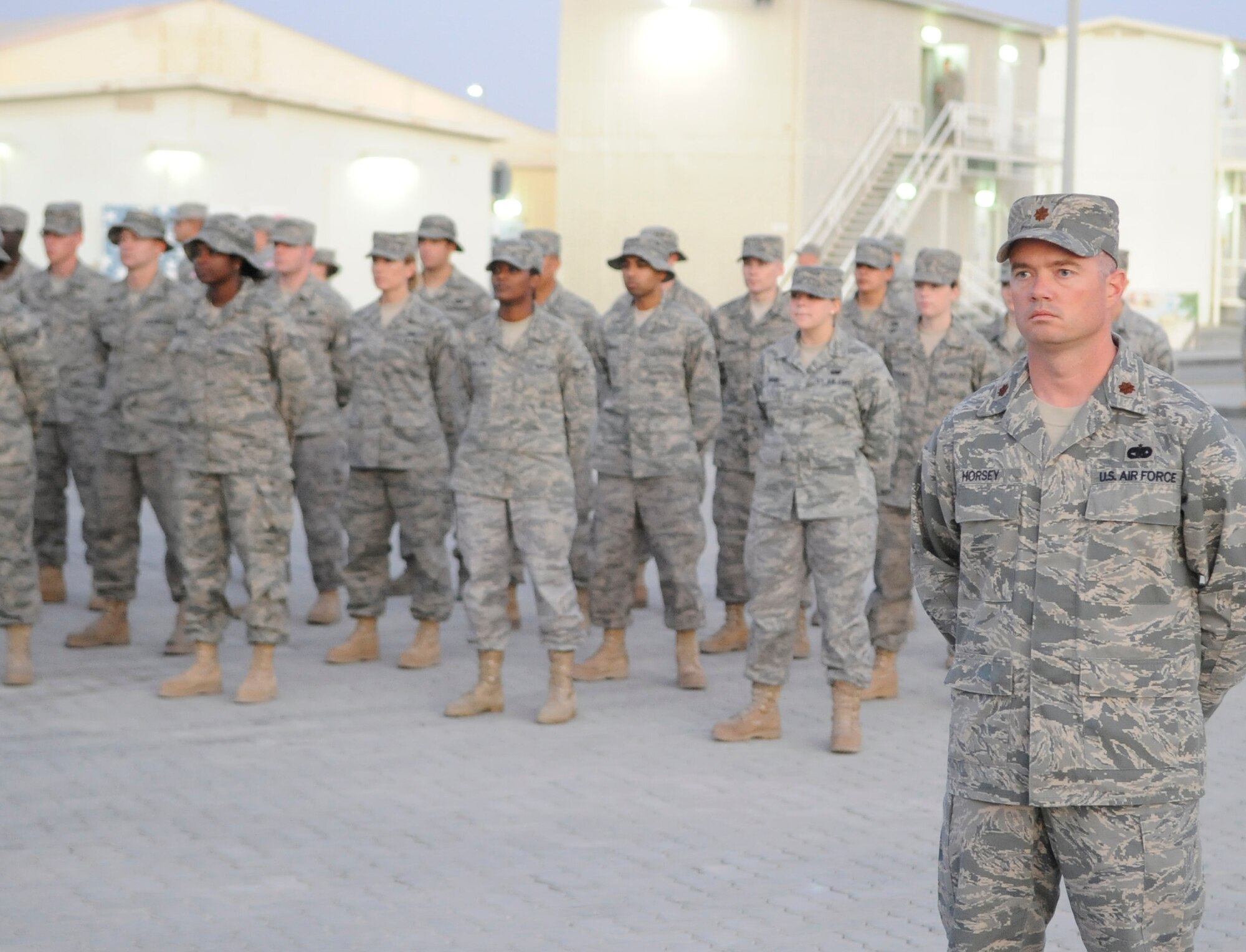 Maj. Michael L. Horsey, director of operations for the 380th Expeditionary Logistics Readiness Squadron, leads a formation of ELRS Airmen during a 380th Air Expeditionary Wing retreat ceremony Nov. 13, 2009. (U.S. Air Force Photo/Released)