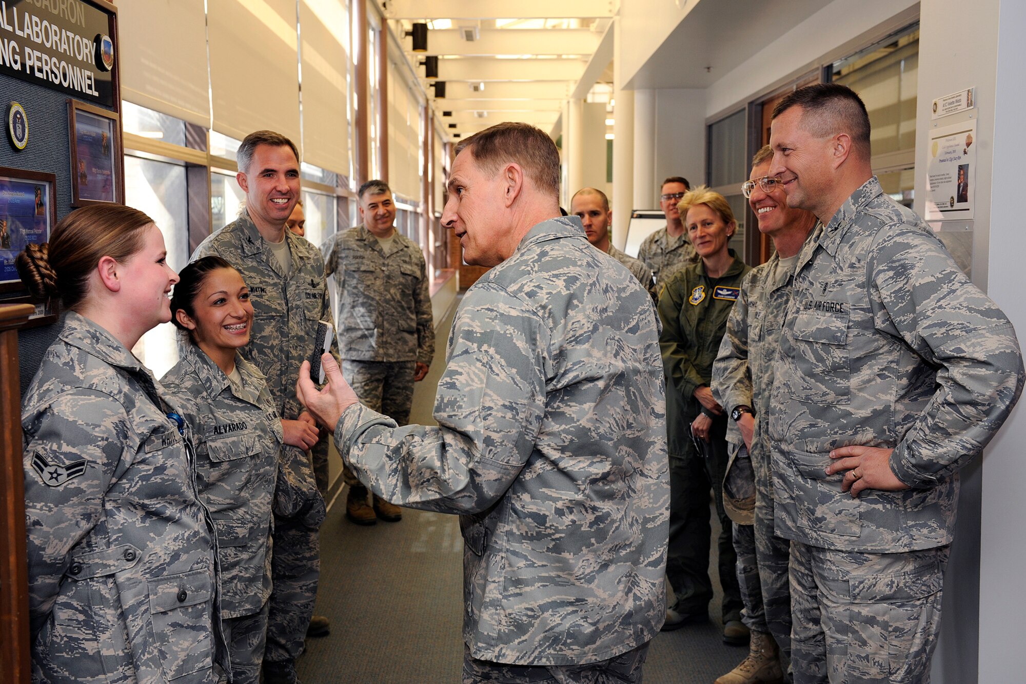 Maj. Gen. Michael J. Basla, Air Force Space Command vice commander (right), thanks Airman 1st Class Annie White, 21st Dental Squadron dental laboratory technician (left front), and Senior Airman Delilah Alvarado, 21st DS dental laboratory technician (second from left), after touring the 21st Dental Squadron area dental laboratory. General Basla visited 21st SW facilities March 25 to learn more about the wing’s operational and installation support activities. (U.S. Air Force photo/ Craig Denton)