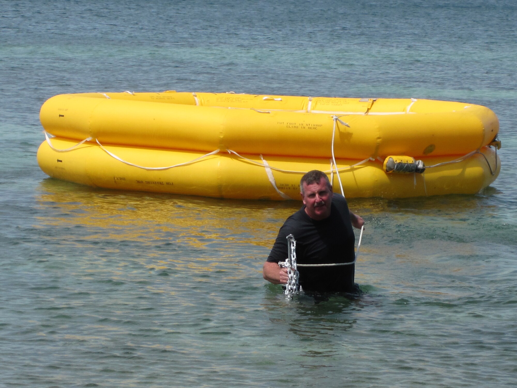 WRIGHT-PATTERSON AIR FORCE BASE, Ohio – Tech. Sgt. Paul Bower, 445th Operational Support Squadron, pulls an empty raft to shore during the two-day water survival class held this year at Naval Air Station Key West, Fla.  More than 45 Airmen from the 445th OSS and 89th Airlift Squadron participated in the March 11-12 class. (Courtesy photo)