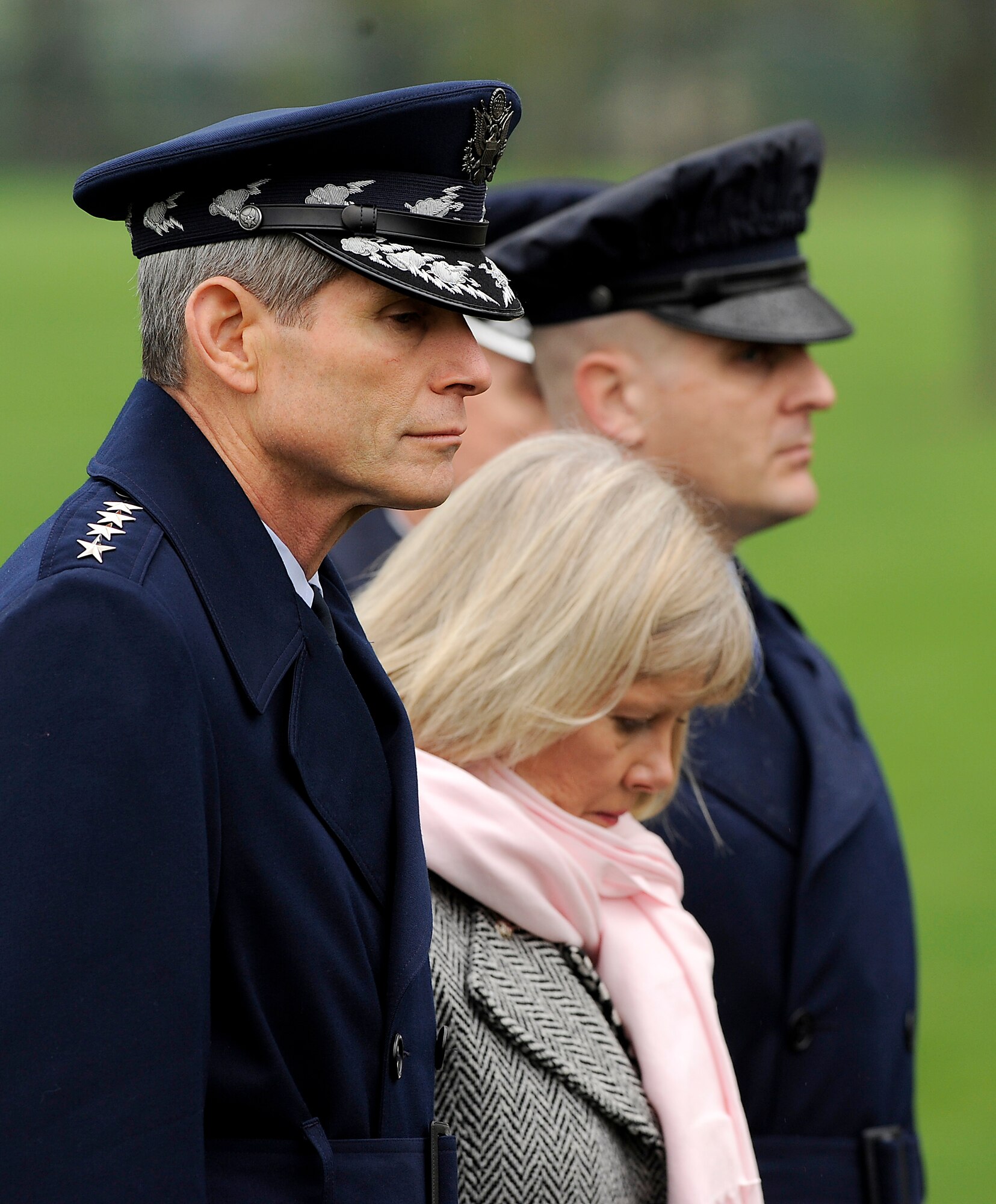 Air Force Chief of Staff Gen. Norton Schwartz, his wife Suzie and Master Sgt. Charles Mercurio, from the Air Force District of Washington Ceremonies and Protocol office, honor Maj. Gen. Jeanne M. Holm during her burial March 29, 2010, at Arlington National Cemetery. General Holm was promoted to major general with an effective date of July 1, 1970, and was the first woman in the Armed Services to serve in that grade.  (U.S. Air Force photo/Scott M. Ash)