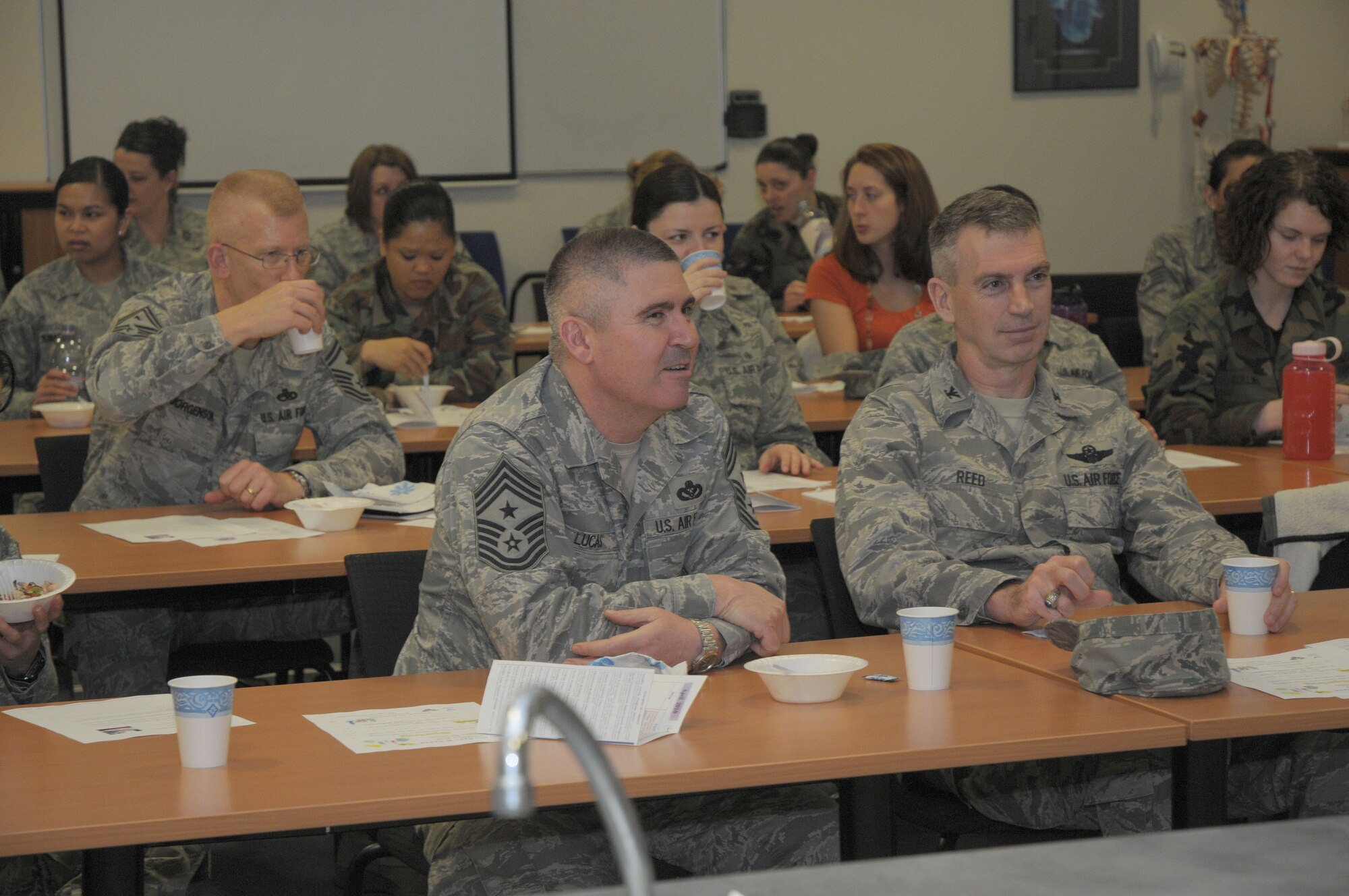 Chief Master Sgt. James Lucas, 48th Fighter Wing command chief and Col. Lawrence Reed, 48th Fighter Wing vice commander listens to cooking instructions during the Woman’s History Month Healthy Cooking class at RAF Lakenheath, England, March 25, 2010.  The healthy cooking class teaches people alternative ways to eat healthy.