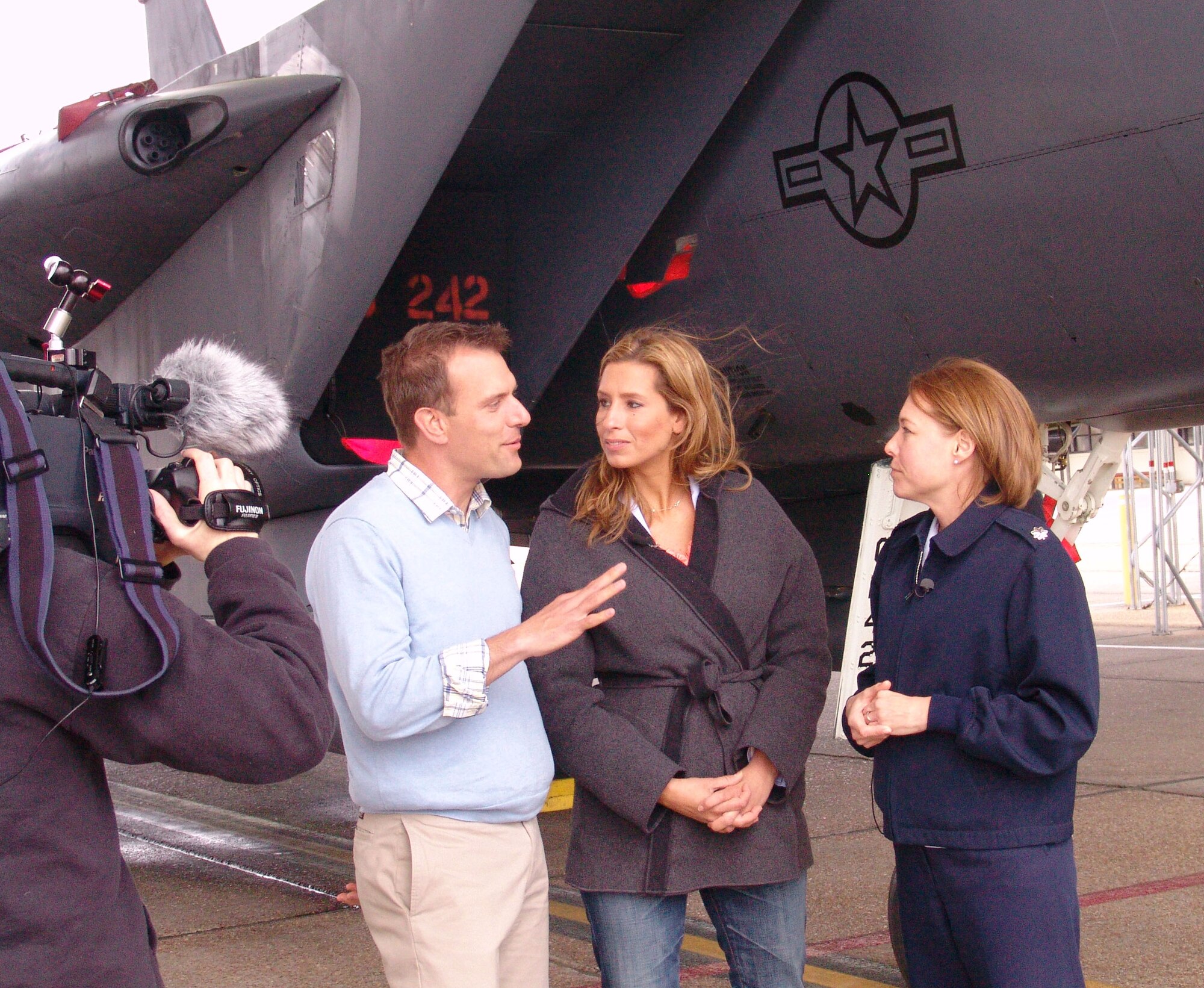 EGLIN AIR FORCE BASE, Fla. -- The Weather Channel's Mike Bettis and Stephanie Abrams talk to Lt. Col. Tamara Parsons, 46th Weather Squadron Commander, about how weather affects Eglin's flying mission.  The Weather Channel is broadcasting live from Destin this week for spring break. (USAF photo/Lois Walsh)