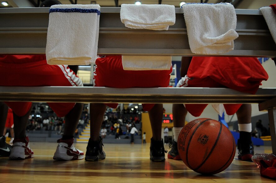 Several players from the Kaiserslautern Panthers watch their teammates play the championship game on Ramstein Air Base, Germany, March 28, 2010. The 86th Services Squadron hosted the U.S. Armed Forces Europe Men’s and Women’s basketball championship series, a tournament consisting of U.S. servicemembers, dependents and retirees from around the European Theater. (U.S. Air Force photo by Airman 1st Class Grovert Fuentes-Contreras)