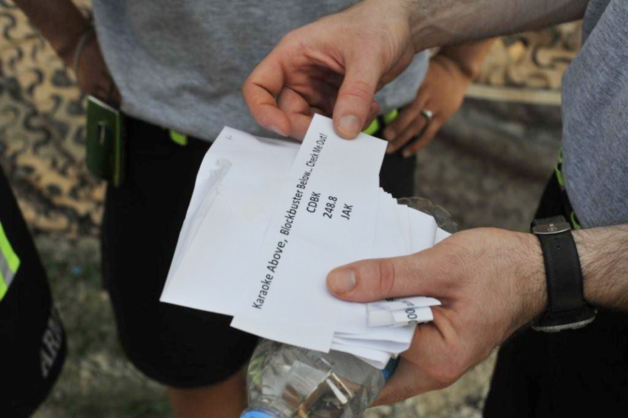 Teams receive clues at each station that lead them to another location during The Amazing Race Afghanistan sponsored by the 455th Expeditionary Force Support Squadron morale, welfare and recreation office, March 28, 2010. (U.S. Navy photo by/ Petty Officer 3rd Class Octavio Ortiz)
