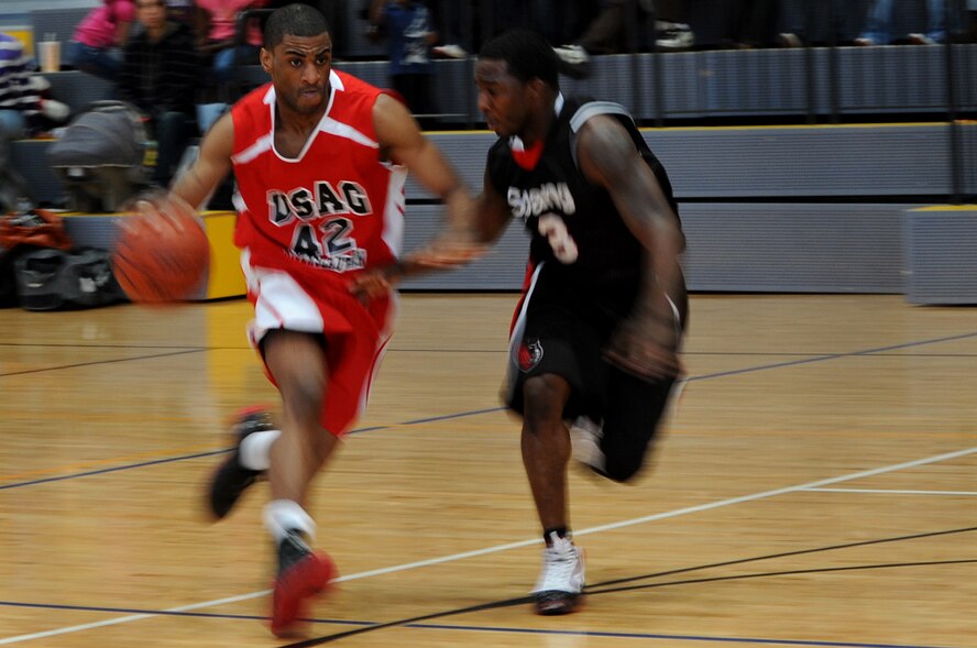 U.S. Army Spc. Lavar Tucker, guard for the Kaiserslautern Panthers, dribbles down the court during the championship game on Ramstein Air Base, Germany, March 28, 2010. The 86th Services Squadron hosted the U.S. Armed Forces Europe Men’s and Women’s basketball championship series, a tournament consisting of U.S. servicemembers, dependents and retirees from around the European Theater. (U.S. Air Force photo by Airman 1st Class Grovert Fuentes-Contreras)