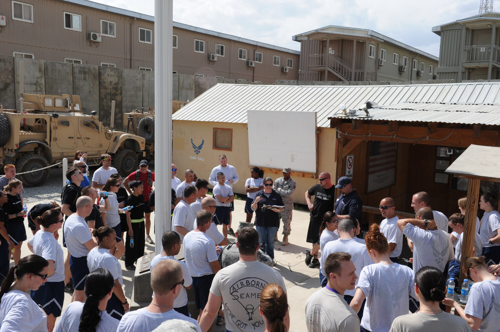 Twenty-five teams gathered at the Camp Cunningham Town Hall for the start of The Amazing Race Afghanistan sponsored by the 455th Expeditionary Force Support Squadron morale, welfare and recreation office, March 28, 2010. Teams competed in nine different challenges around Bagram Airfield designed to test their mental and physical toughness. (U.S. Air Force Photo by/ Staff Sgt. Richard Williams)