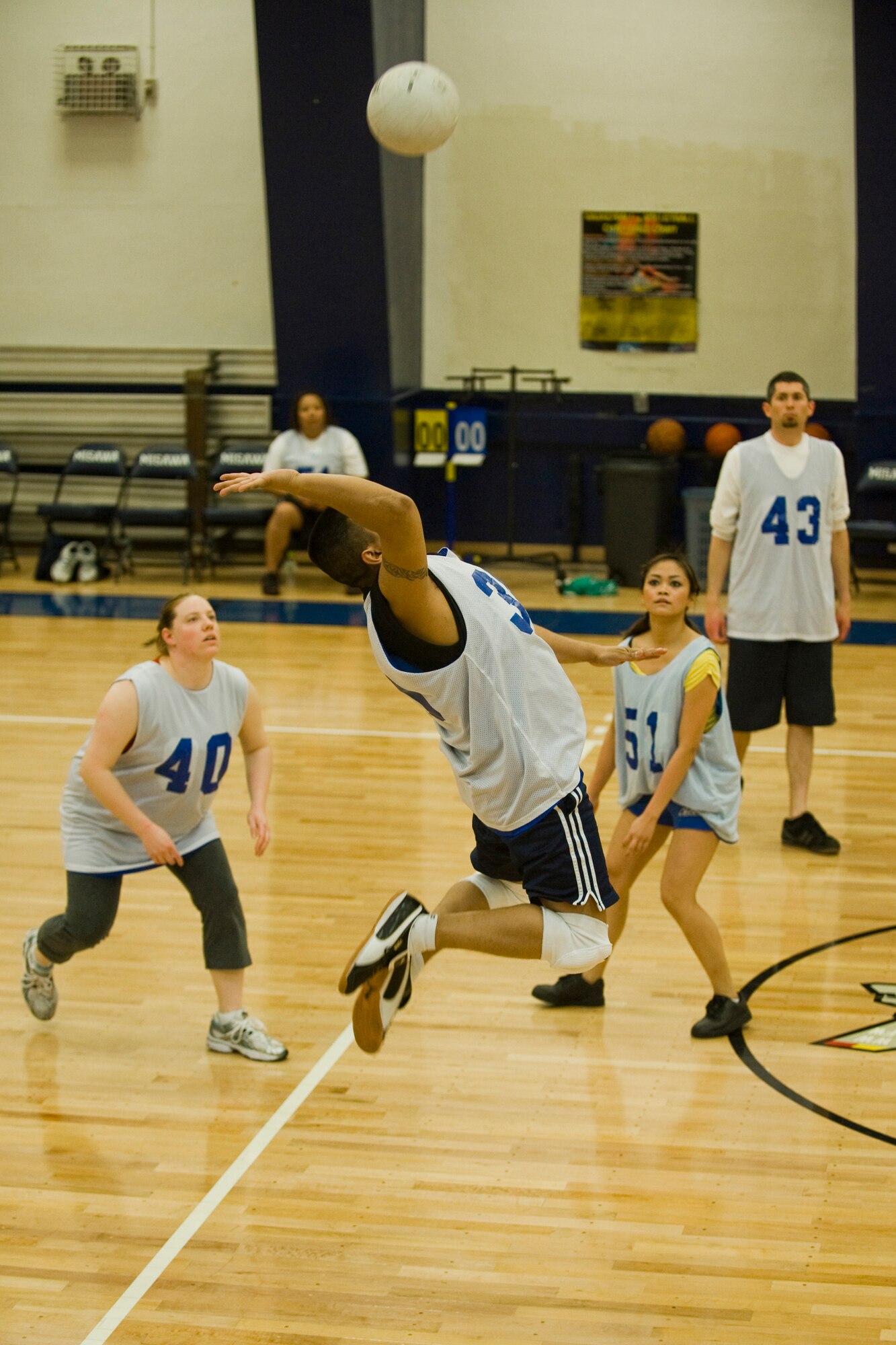 MISAWA AIR BASE, Japan -- Staff Sgt. Juan Rodriguez, of the 35th Force Support Squadron, jumps to hit the ball during a volleyball game against the 35th Communications Squadron March 29 at the Potter Fitness Center. Sergeant Rodriguez has played volleyball since he was 11 years old and has participated in intramural league volleyball for the past five years. (U.S. Air Force photo/Senior Airman Jamal D. Sutter)