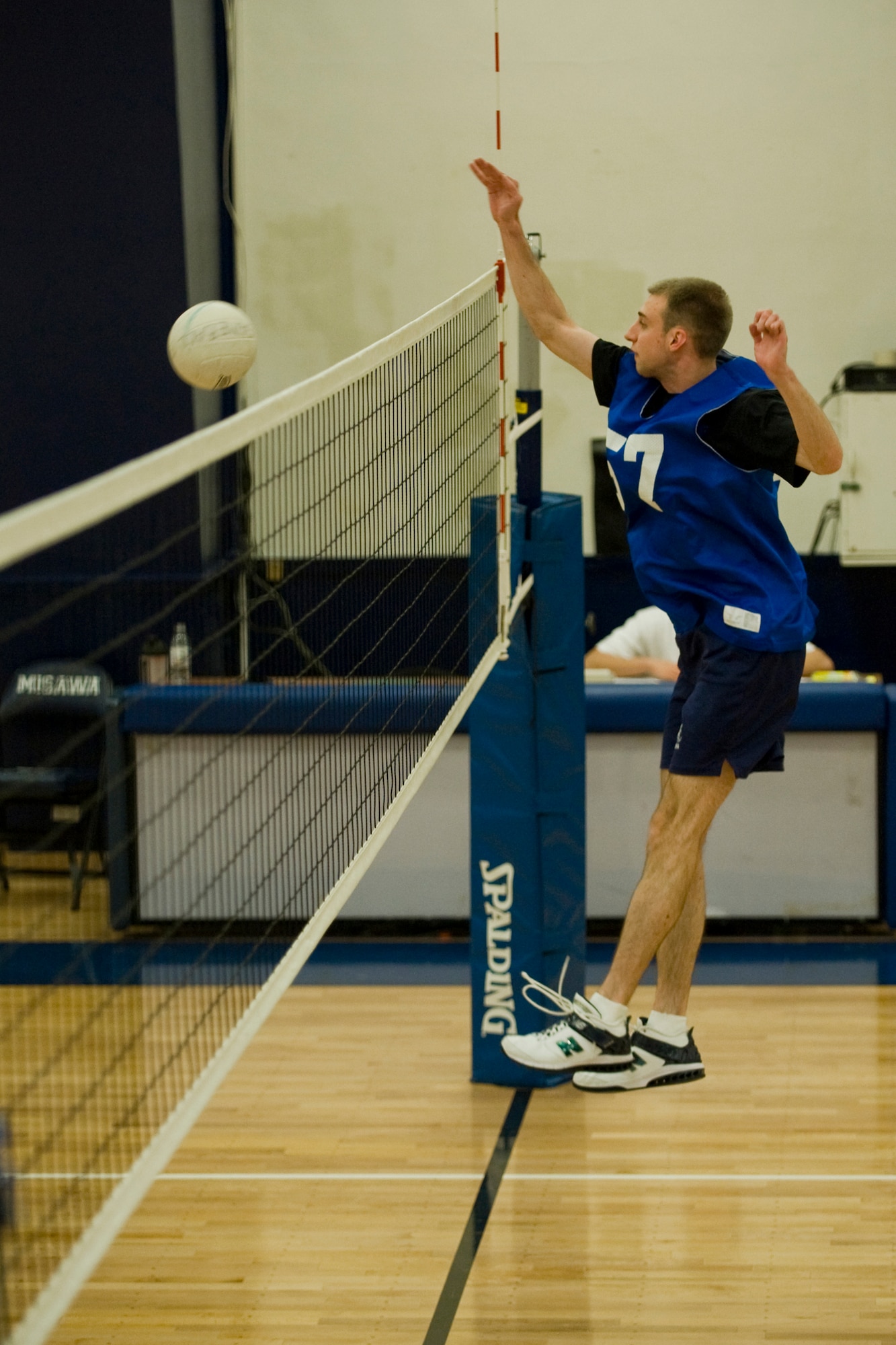 MISAWA AIR BASE, Japan -- 2nd Lt. John Cobb, of the 35th Communications Squadron, returns the ball during a volleyball game against the 35th Force Support Squadron March 29 at the Potter Fitness Center. 35th FSS won the deciding, third set by two points. (U.S. Air Force photo/Senior Airman Jamal D. Sutter)