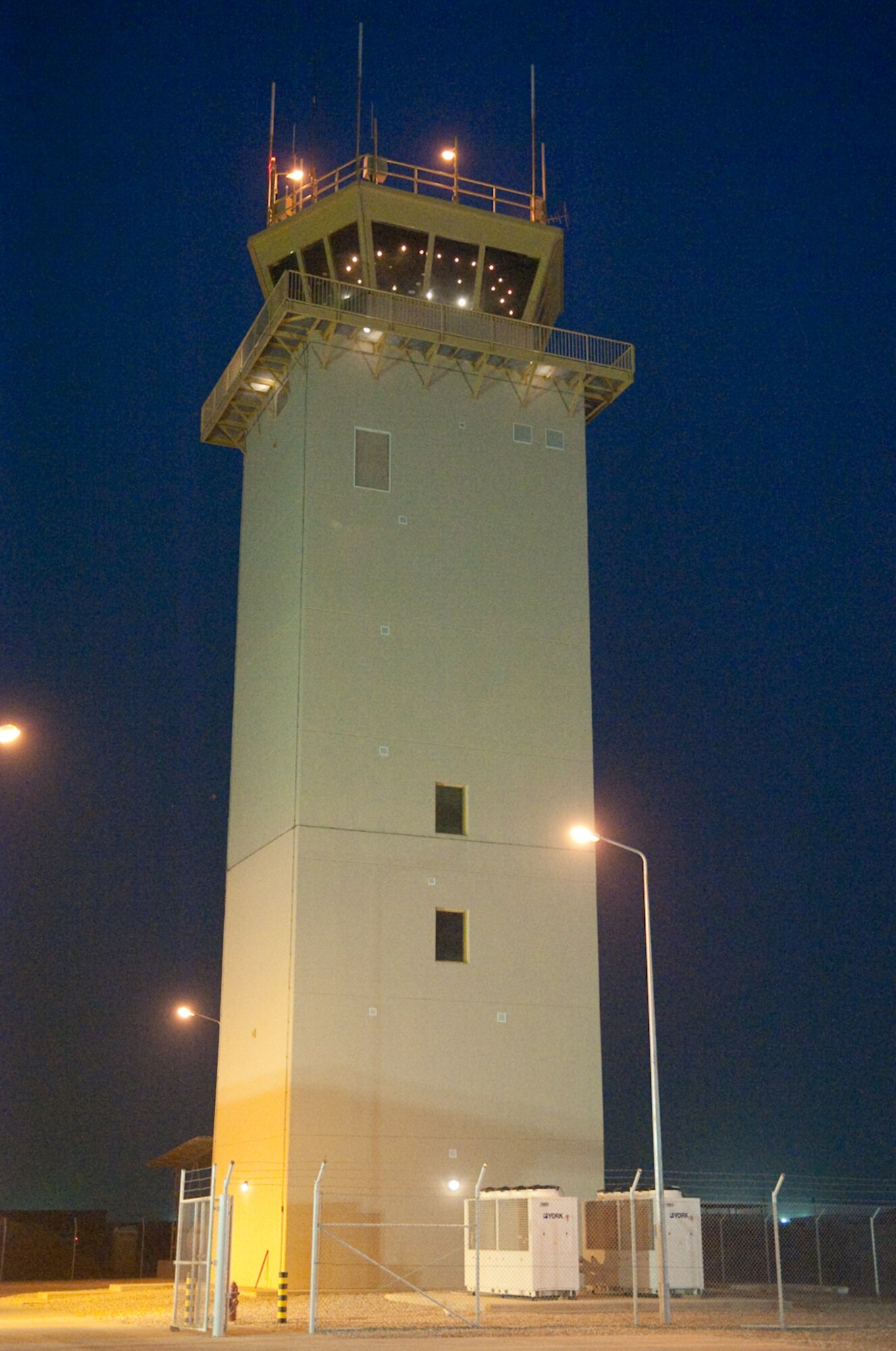 Air Traffic Control tower at dusk standing tall and monumental at Ali Base,
Iraq March 27, 2010. The 104 foot tower, the tallest structure in southern
Iraq, is the capstone to a $61.7 million military construction project
designed to improve overall airfield operations. (U.S. Air Force photo by
Senior Master Sgt. Elizabeth Gilbert)  
