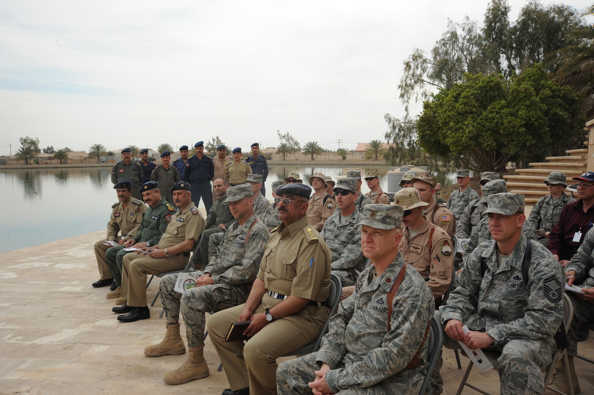 A crowd gathers for the graduation of the first class of Iraqi air force meteorology officer’s at the Air Force House, Camp Victory, Iraq, March 25, 2010. The graduates will be sent to different locations throughout Iraq for 30 days of on-the-job training. Once the training is concluded, some of the weather advisory officers will become instructors while others will begin their weather advisory mission for the Iraqi military. (U.S. Air Force photo/Master Sgt. Trish Bunting/Released)