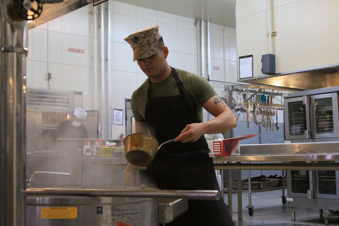 Lance Cpl. Jesus E. Hernandez, northside mess hall food service specialist and 2010 Marine Corps Bases Japan Chef of the Quarter Board winner, prepares a chili dish at the northside mess hall here March 29. Hernandez became the first Marine stationed here to win the MCBJ Chef of the Quarter Board.