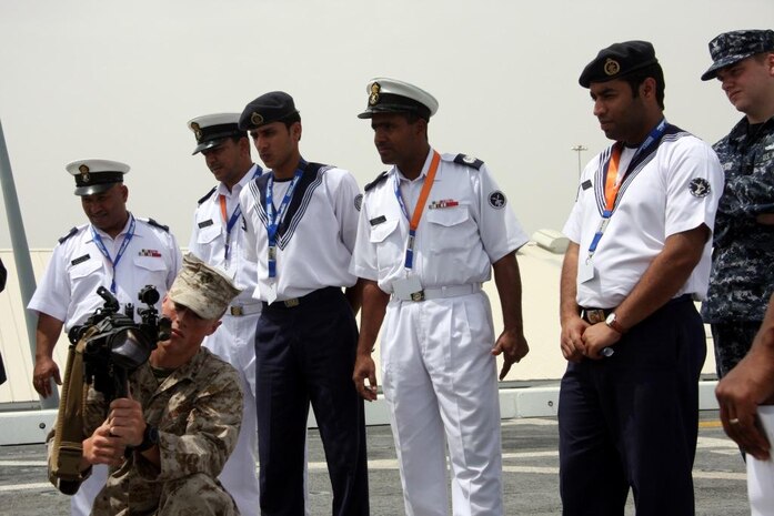 24th Marine Expeditionary Unit Marines and Sailors aboard USS Mesa Verde manned static displays where tour groups could interact with Marines and some of the equipment and weapons they employ.  The tour groups were part of a three day exhibition where vessels from 13 nations gathered at a port in Doha and allowed visitors to have a look at what it's like to live aboard each of their ships.  USS Mesa Verde (LPD 19), part of the Nassau Amphibious Readiness Group,  joined 12 other warships from around the world at the Doha international port to participate in the Doha International Maritime Defense Exhibition and Conference March 29-31.