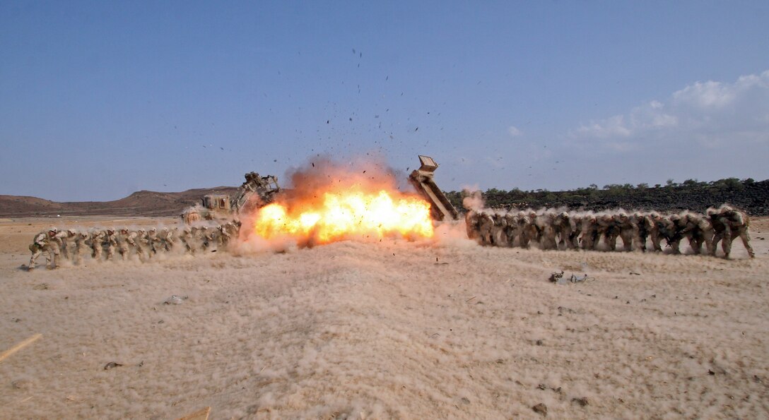 Marines from 2nd Combat Engineer Battalion instruct Marines from Scout Sniper platoon, and Alpha Company, Battalion Landing Team 1st Battalion, 9th Marine Regiment, 24th Marine Expeditionary Unit, on a demolitions range and breaching course while in Djibouti. The 24th MEU remains as one of the most expedient units and rapid-response force ready to perform a full scale of missions ranging from humanitarian relief to full-scale combat operations.