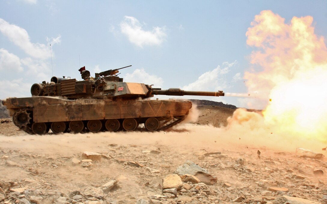 An M1A1 Abrams battle tank from Tank Platoon, Battalion Landing Team 1st Battalion, 9th Marine Regiment, 24th Marine Expeditionary Unit, fires off a 120mm round towards a target tank hull during a live-fire range in Djibouti, Africa, March 30, 2010.  The Marine tank platoon engaged various targets alongside the French Foreign Legion’s 13th Demi-Brigade as part of a bi-lateral training exercise where both military forces learned about each other armored capabilities.  The 24th MEU performed a series of sustainment and bi-lateral training exercises alongside the French military during a month-long rotation of troops from the 24th MEU in Djibouti.  The 24th MEU deployed in January aboard Navy ships of the Nassau Amphibious Ready Group, and is currently serving as the theatre reserve force for Central Command.  The training in Djibouti is one of the various training exercise the 24th MEU is conducting while in CENTCOM.  (U.S. Marine Corps photo by Sgt. Alex C. Sauceda)::r::::n::::r::::n::