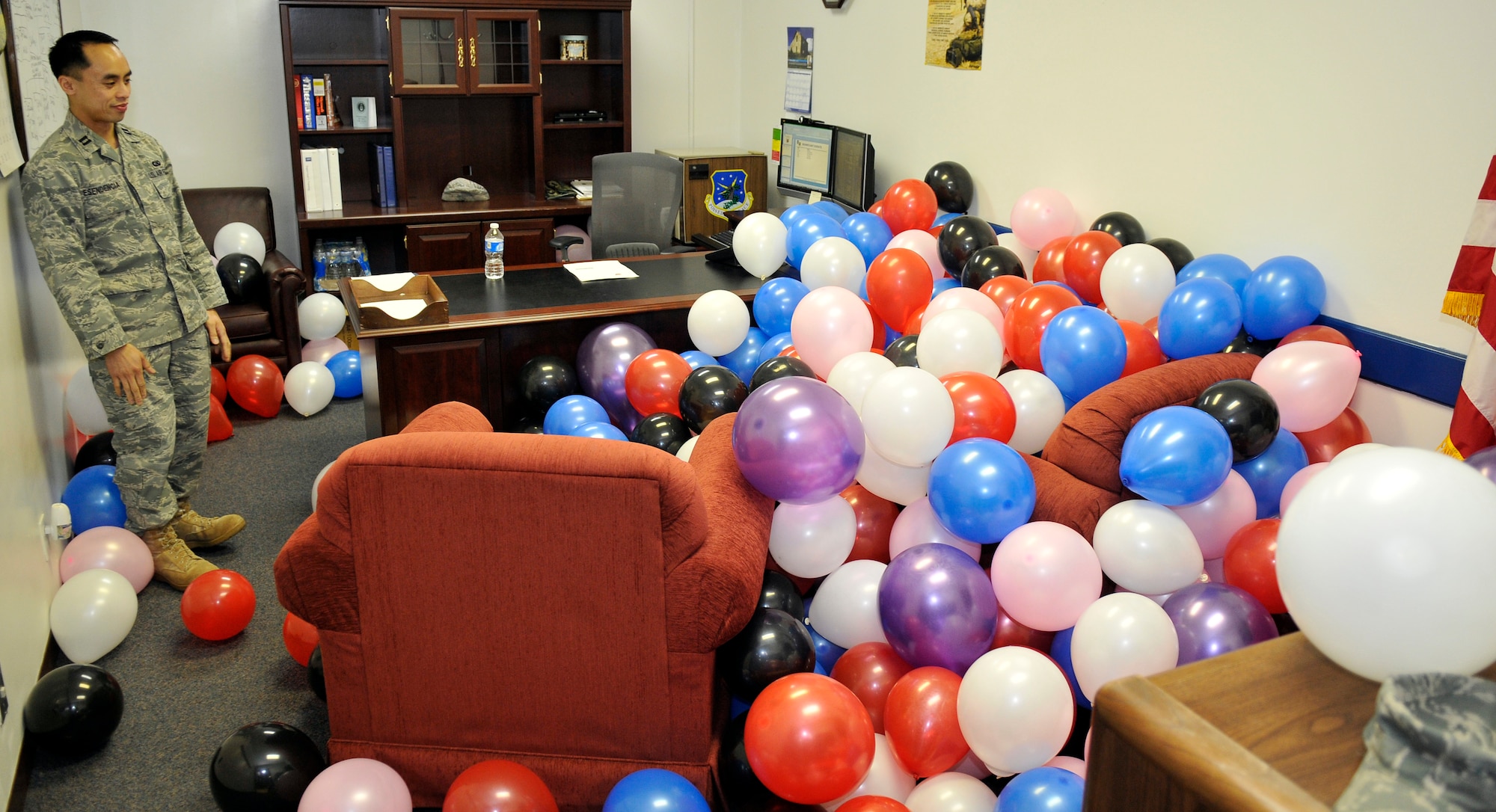MISAWA AIR BASE, Japan – Capt. Bryant Esendencia, 35th Communications Squadron director of operations, discovers a sea of approximately 100 balloons in his office April 1. The prank was compliments of his Airmen. Captain Esendencia was one of many Airmen across Misawa to fall prey to April fool’s high-jinks. (U.S. Air Force photo/Staff Sgt. Phillip Butterfield)