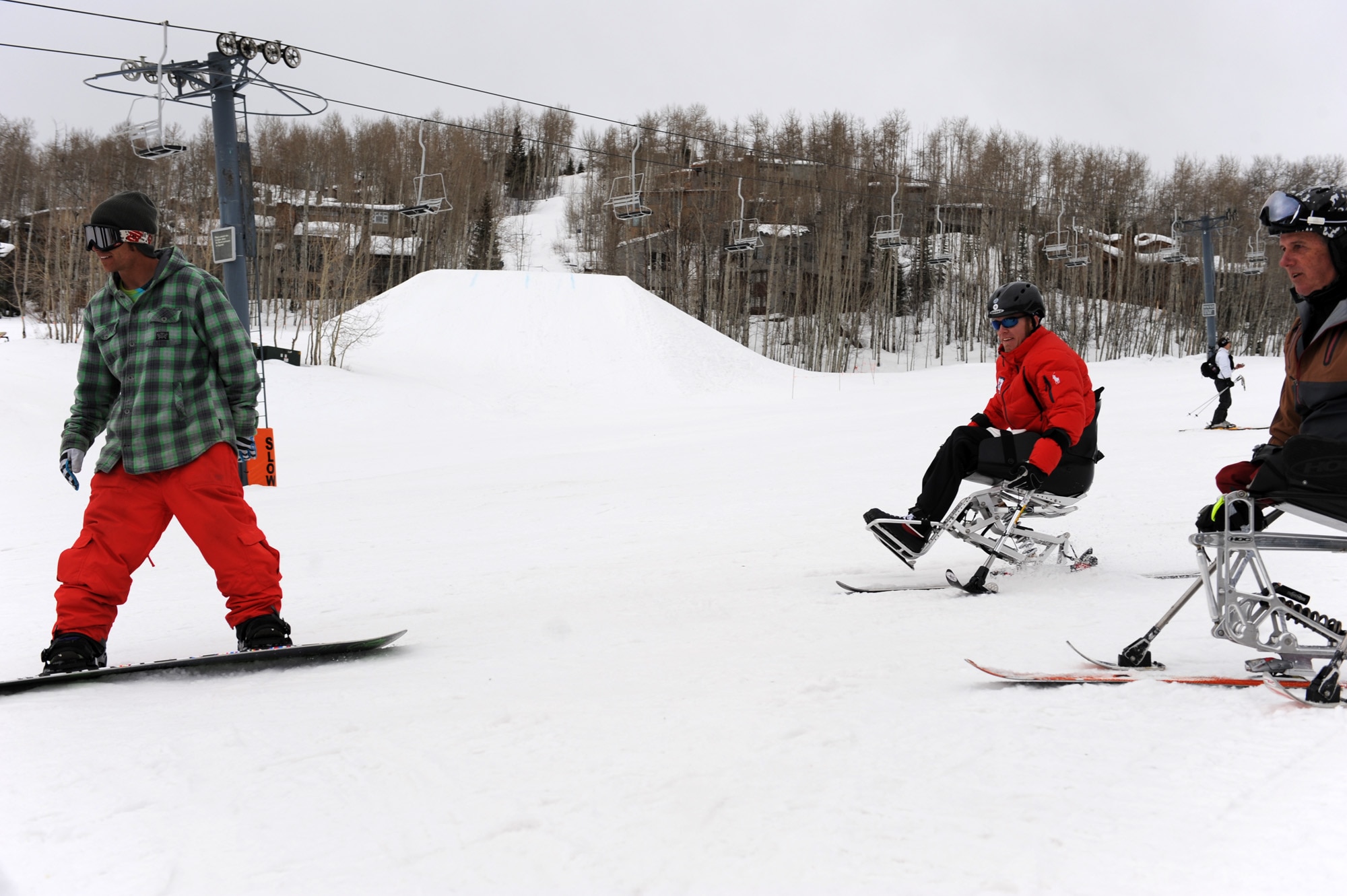 Veterans Sean Halsted and Jim Martinson ski with Andy Finch March 31, 2010, during the 24th National Disabled American Veterans Winter Sports Clinic in Snowmass Village, Colo. Mr. Finch is an Olympian snowboarder. Mr. Halsted  and Mr. Martinson are U.S. Paralympians. The event is sponsored by the Department of Veterans Affairs and Disabled American Veterans. (U.S. Air Force photo/Staff Sgt. Desiree N. Palacios)