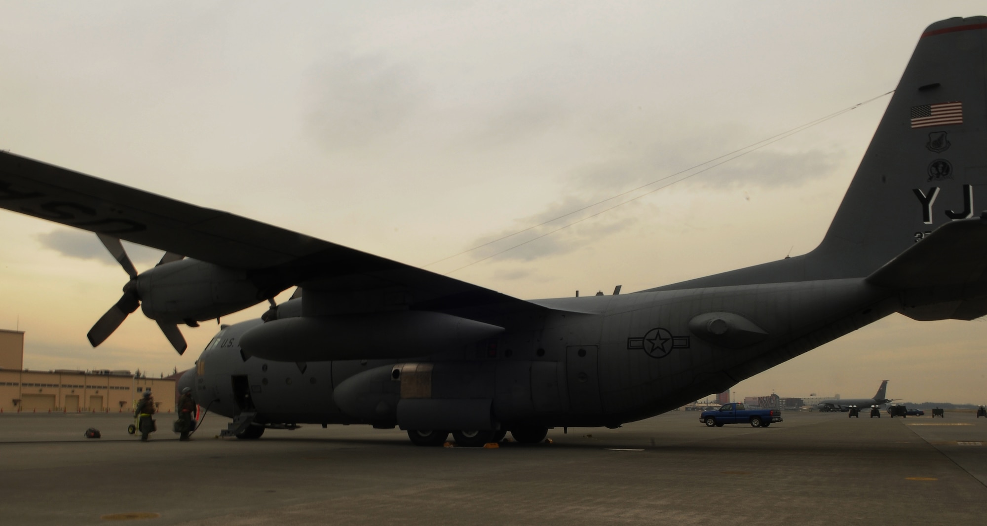 YOKOTA AIR BASE, Japan -- A C-130H Hercules waits on the flight line prior to launching as part of a five-ship launch formation exercise Mar. 31. The exercise tested Yokota Airman's operational readiness preparedness. (U.S. Air Force photo/Airman 1st Class Devin Doskey)