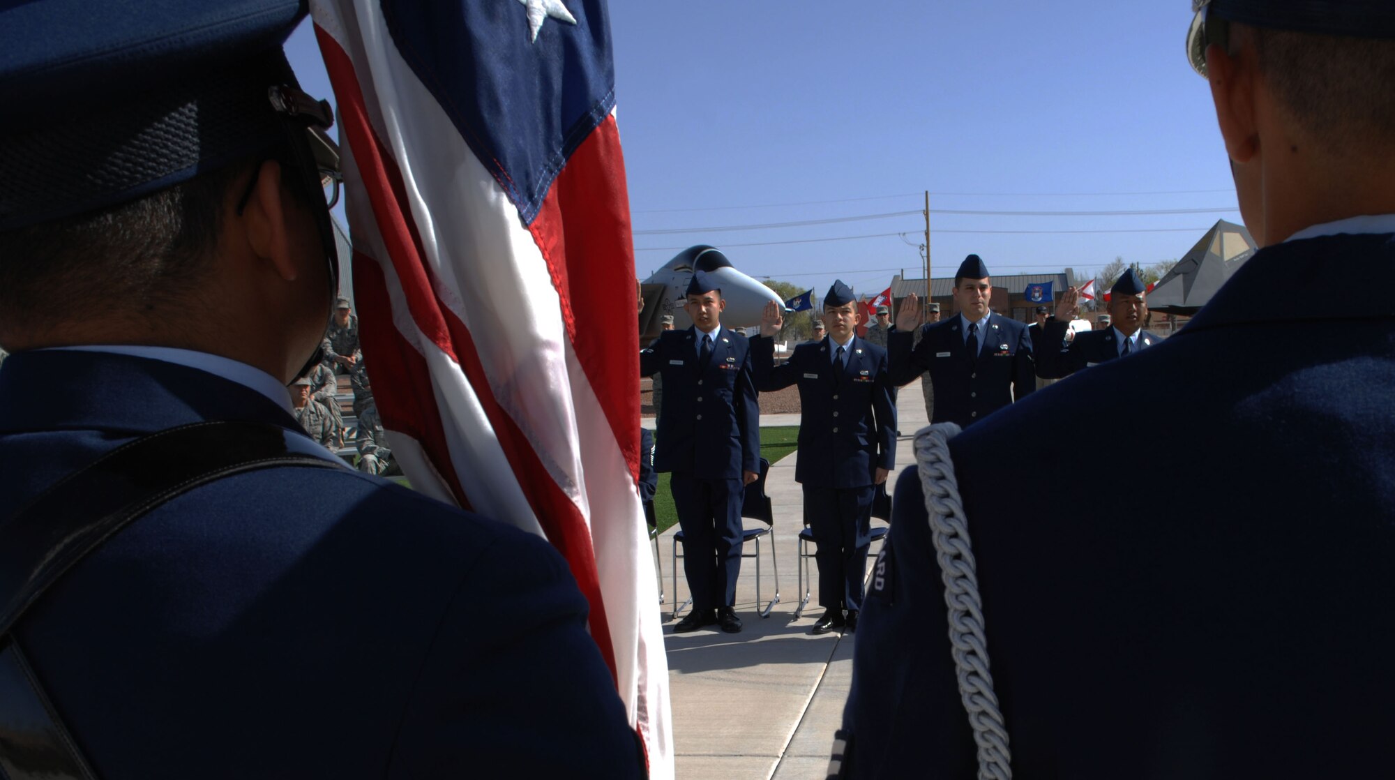 HOLLOMAN AIR FORCE BASE, N.M. -- Airmen raise their right hand and recite the oath of citizenship during a Naturilization Cermony, March 26, 2010 at Heritage Park. Since September 2001, more than 53,000 U.S. armed forces members have been naturalized by the U.S. Citizenship and Immigration Services. (U.S. Air Force photo by Airman 1st Class Joshua Turner)(Released)
