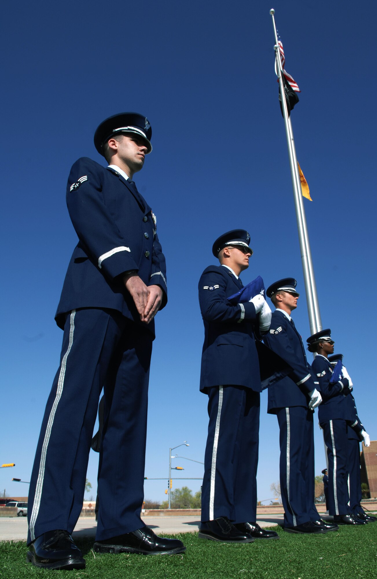 HOLLOMAN AIR FORCE BASE, N.M. -- Members of the Steel Talons Honor Guard stand-by before a Naturilization Ceremony, March 26, 2010 at Heritage Park, Where four Airmen became naturalized American citizens. Since September 2001, more than 53,000 U.S. armed forces members have been naturalized by the U.S. Citizenship and Immigration Services. (U.S. Air Force photo by Airman 1st Class Joshua Turner)(Released)