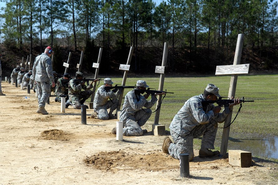 Combat Arms training course students begin firing from the kneeling position at the firing range March 30. The students are required to shoot in several different firing positions in order to remain proficient for real world combat. (U.S. Air Force photo/Senior Airman Kris Levasseur)