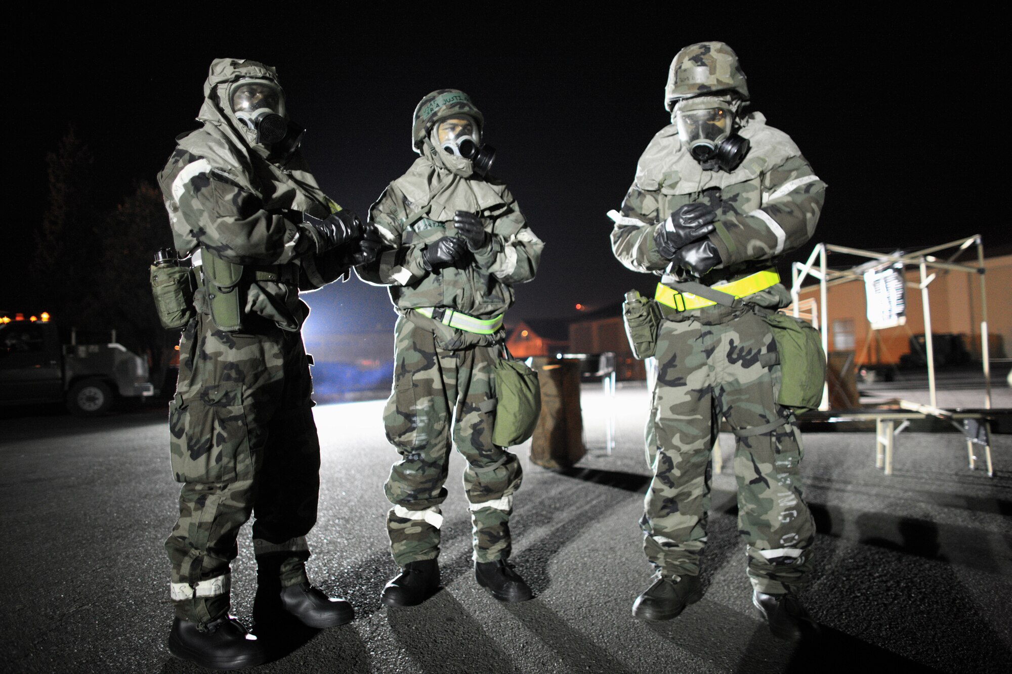 YOKOTA AIR BASE, Japan -- A members from the 374th Operation Support Squadron wait to process simulated contaminated aircrew member through a Contamination Control Point here Apr. 1. Yokota conducted an exercise 28 Mar. through 1 Apr. to help maintain operational readiness.  (U.S. Air Force photo/Osakabe Yasuo)