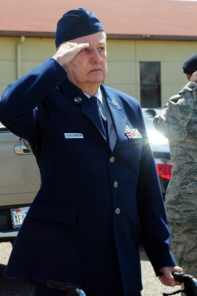 BARKSDALE AIR FORCE BASE, La. -- Chief Master Sgt. James Flascheriem, Charter Chief, salutes the flag during a retreat ceremony performed by the students of Airman Leadership School class 10-4 March 26. The students performed a retreat ceremony in Chief Flascheriem's honor after he donated his white mess dress to the school. The set of white mess dress that now resides in the school house is one of only three left in existence. Commandant Master Sgt. Neil Heerdink and ALS instructor Staff Sgt. Allison Cain assembled the display case of the Chief's memorabilia. (U.S. Air Force photo by Senior Airman Joanna M. Kresge)