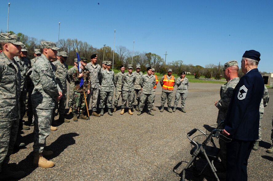 BARKSDALE AIR FORCE BASE, La. -- Chief Master Sgt. James Flascheriem, Charter Chief, addresses the students of Airman Leadership School class 10-4 March 26. The students performed a retreat ceremony in Chief Flascheriem's honor after he donated his white mess dress to the school. The set of white mess dress that now resides in the school house is one of only three left in existence. Commandant Master Sgt. Neil Heerdink and ALS instructor Staff Sgt. Allison Cain assembled the display case of the Chief's memorabilia. (U.S. Air Force photo by Senior Airman Joanna M. Kresge)