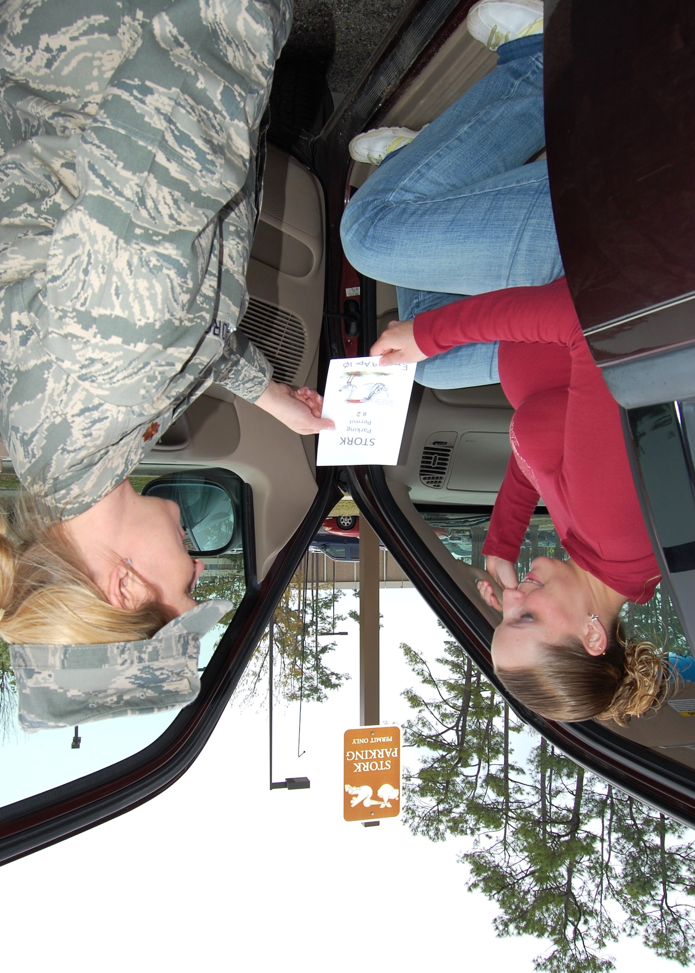 Briann Stevenson receives a “stork parking” permit from Maj. Lea Thies, nurse manager of the 81st Surgical Operations Squadron women’s health clinic, in the 81st Medical Group Hospital’s newly-designated “stork parking” areas.   Seven designated spots are west of the outpatient services entrance adjacent to the new radiation oncology clinic, and five more are in the parking lot opposite the hospital’s “A” tower. Expectant mothers who are 32 weeks pregnant are given permits that expire two weeks after their expected due date.  Mrs. Stevenson’s husband, Todd, is assigned to the Naval Construction Battalion Center Gulfport.  They are expecting their first child, a daughter.  The women’s health clinic sees about 120 obstetrics patients weekly, with about 80 patients currently 32 weeks or more into their pregnancies.  (U.S. Air Force photo by Steve Pivnick)