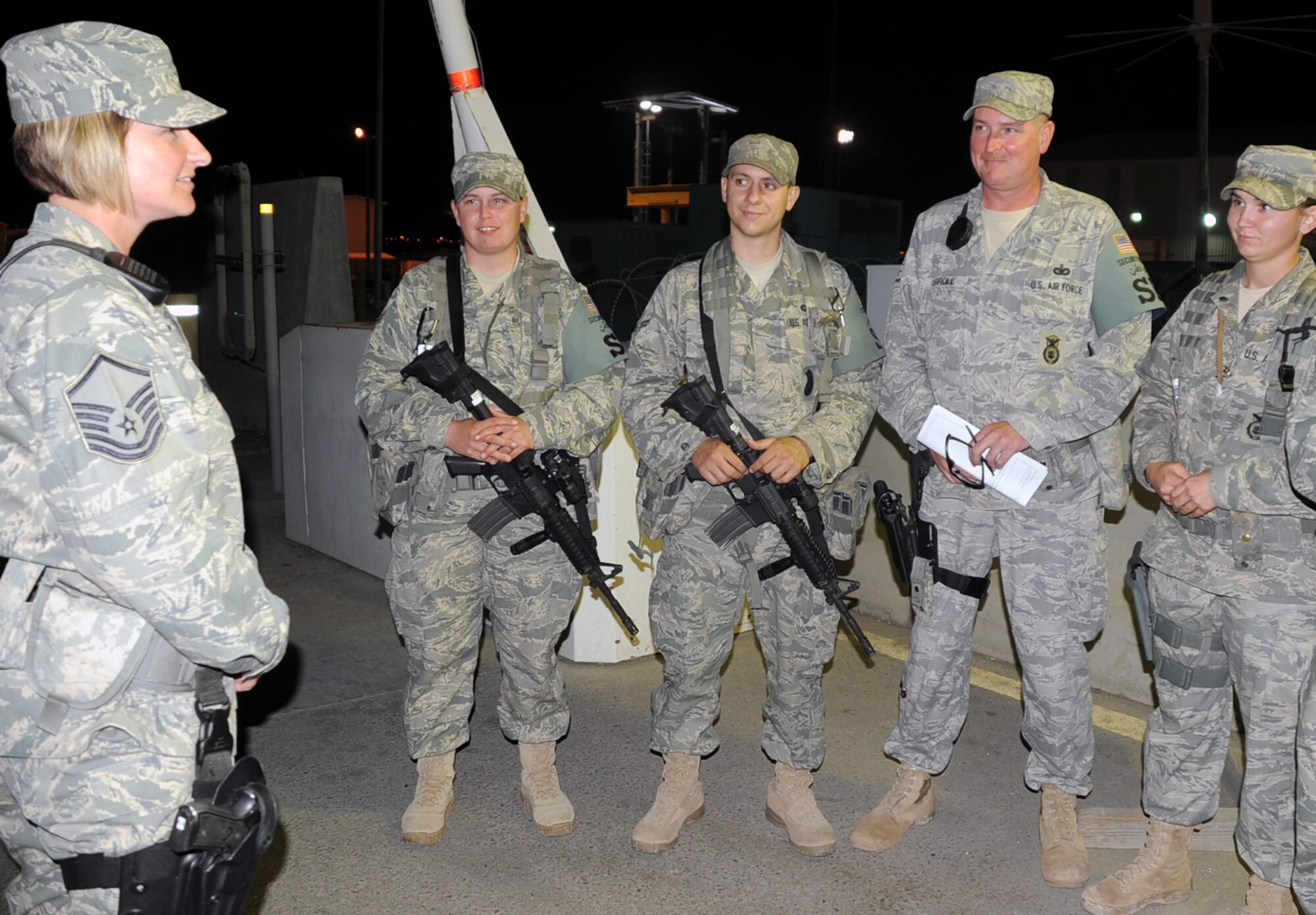 Sergeant Phillips briefs security forces Airmen in “Alpha” flight during a night shift Jan. 24.  The 380th ESFS is in charge of protecting and providing security for millions of dollars of deployed Air Forces assets and nearly 2,000 deployed personnel.  Sergeant Phillips is a 16-year Air Force veteran deployed from the 81st SFS.  (Air Force photos)