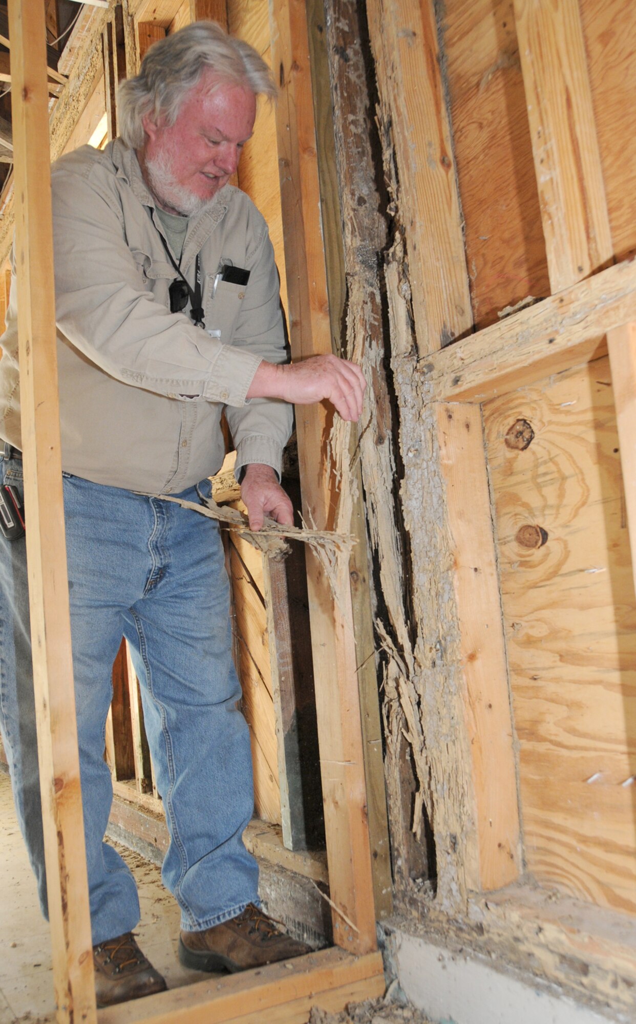 CSC pest management supervisor Phillip Remel shows termite damage at the base post office.  The post office moves to a new facility this spring.  (U.S. Air Force photo by Kemberly Groue)
