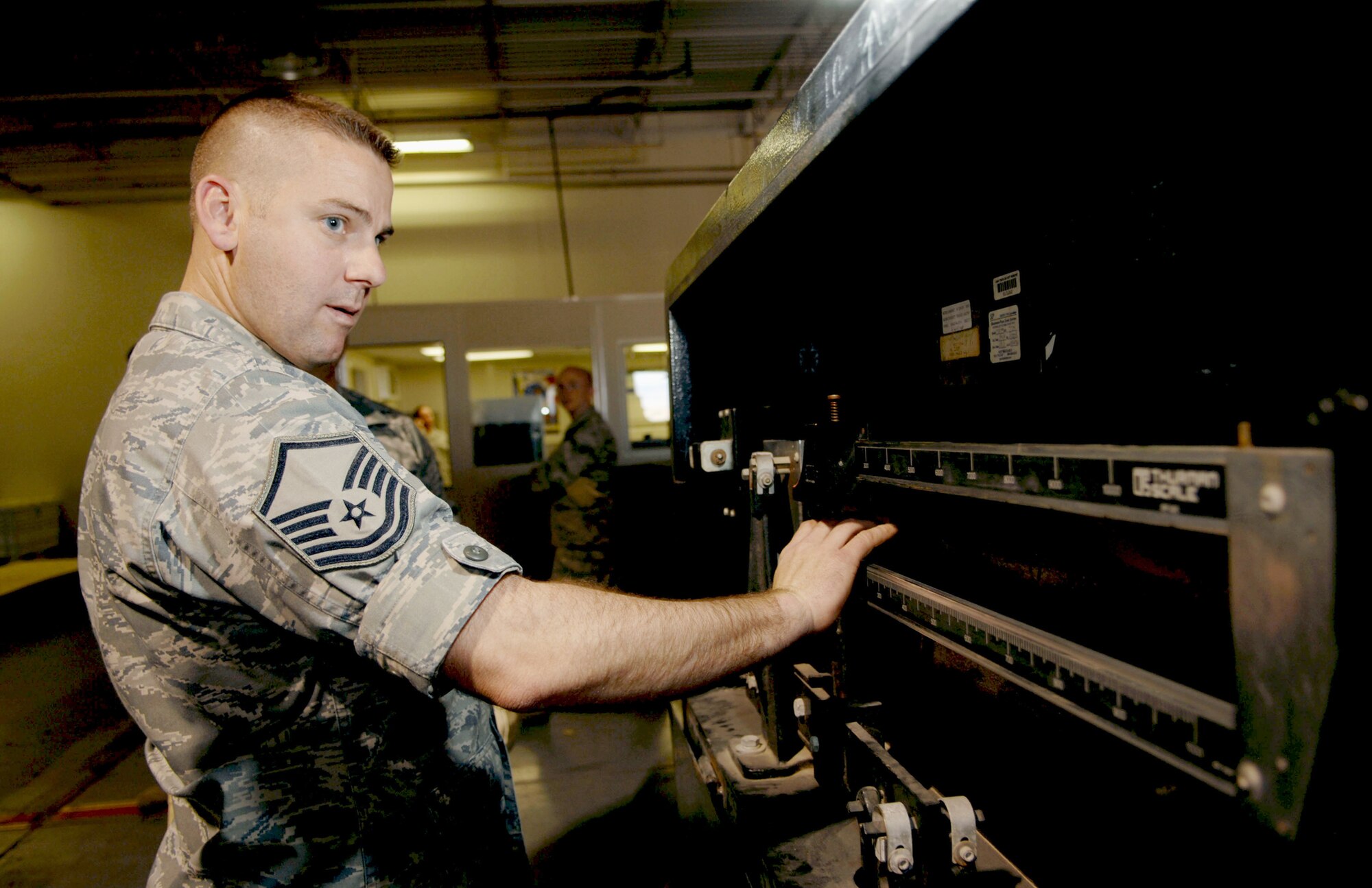 Master Sgt. Daniel Keene weighs a relief package that was delivered to Chile March 17, 2010, at Holloman Air Force Base, N.M. The relief package consisted of more than 5,000 pounds of tools and supplies to assist in the relief operations in Chile. The South American nation was hit by an 8.8 magnitude earthquake, Feb. 27, 2010. Sergeant Keene is the 49th Logistics Readiness Squadron vehicle fleet manager. (U.S. Air Force photo/Airman 1st Class Joshua Turner)