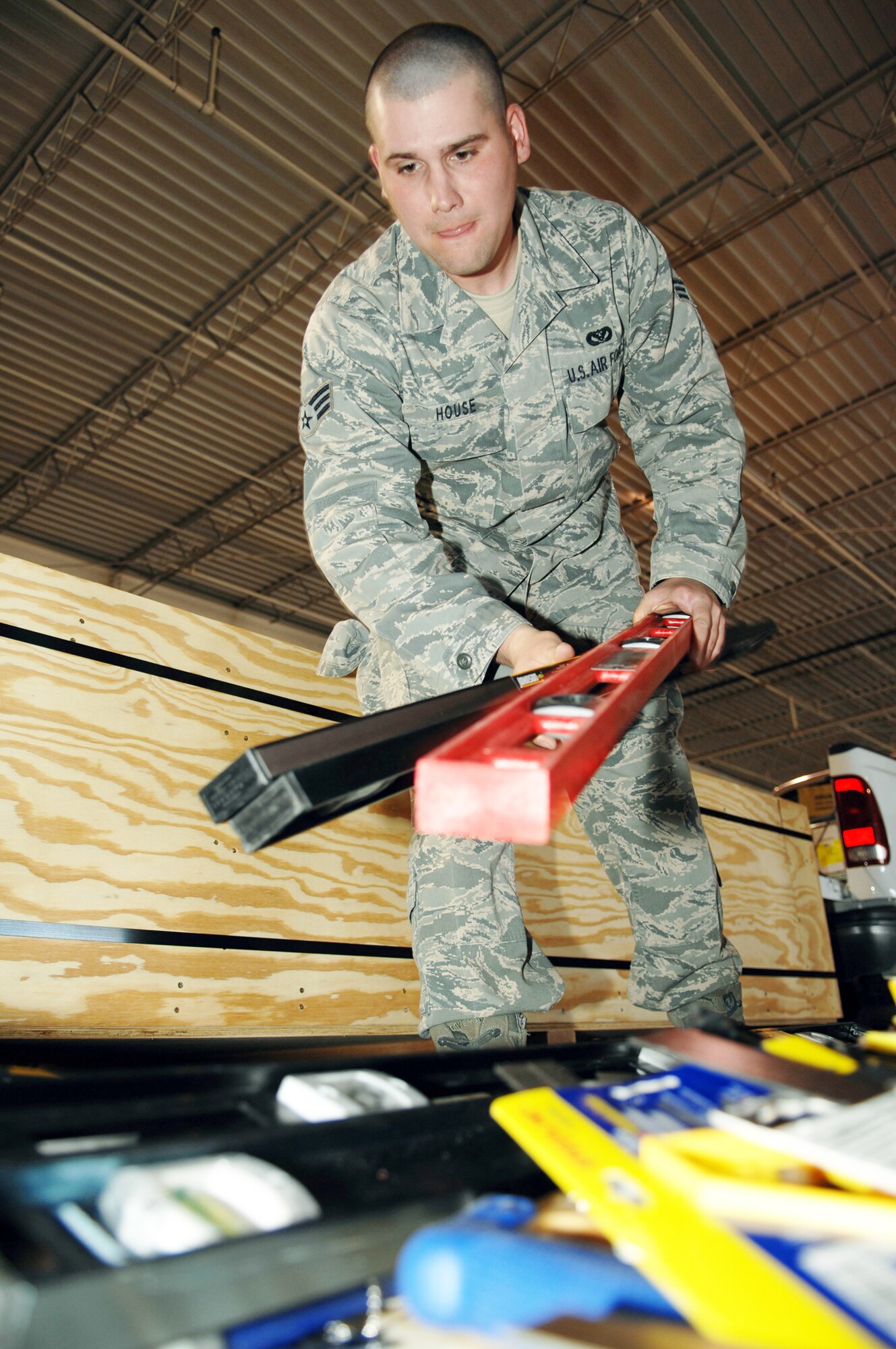 Senior Airman Clinton House loads tools into a relief package March 17, 2010, at Holloman Air Force Base, N.M. Members of the 49th Civil Engineer Squadron put together a package of tools and supplies to assist in the relief operations in Chile following the 8.8 magnitude earthquake that hit the South American nation Feb. 27, 2010. Airman House is assigned to the 49th CES. (U.S. Air Force photo/Airman 1st Class Joshua Turner)
