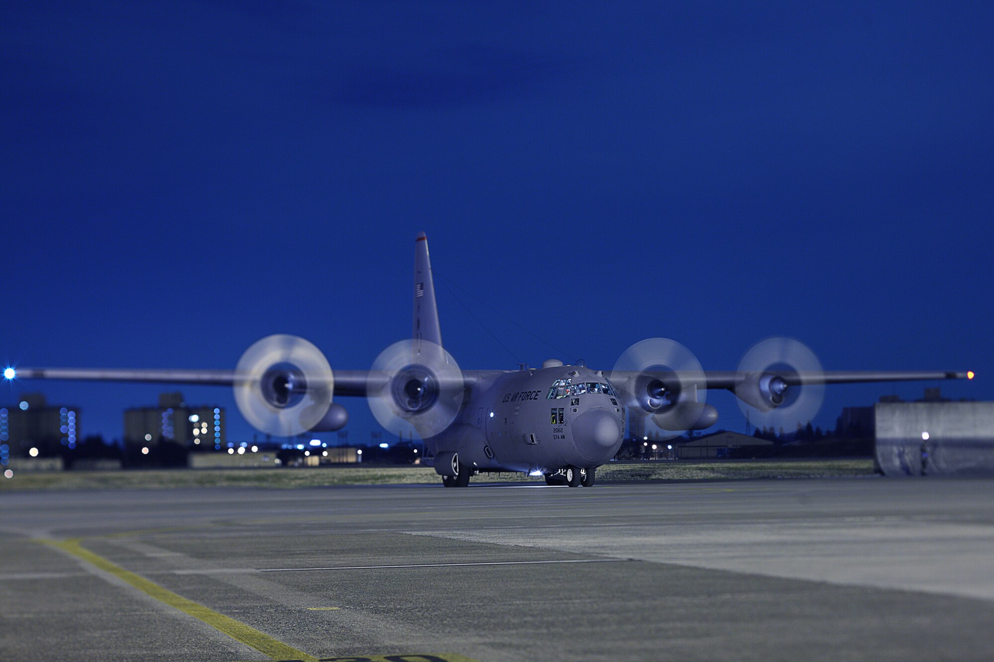 A C-130H Hercules waits to taxi down the flight line after returning from an earlier five-ship launch formation exercise here 31 Mar. Yokota conducted an exercise 28 Mar. through 1 Apr. to help maintain operational readiness.  (U.S. Air Force photo/Osakabe Yasuo)