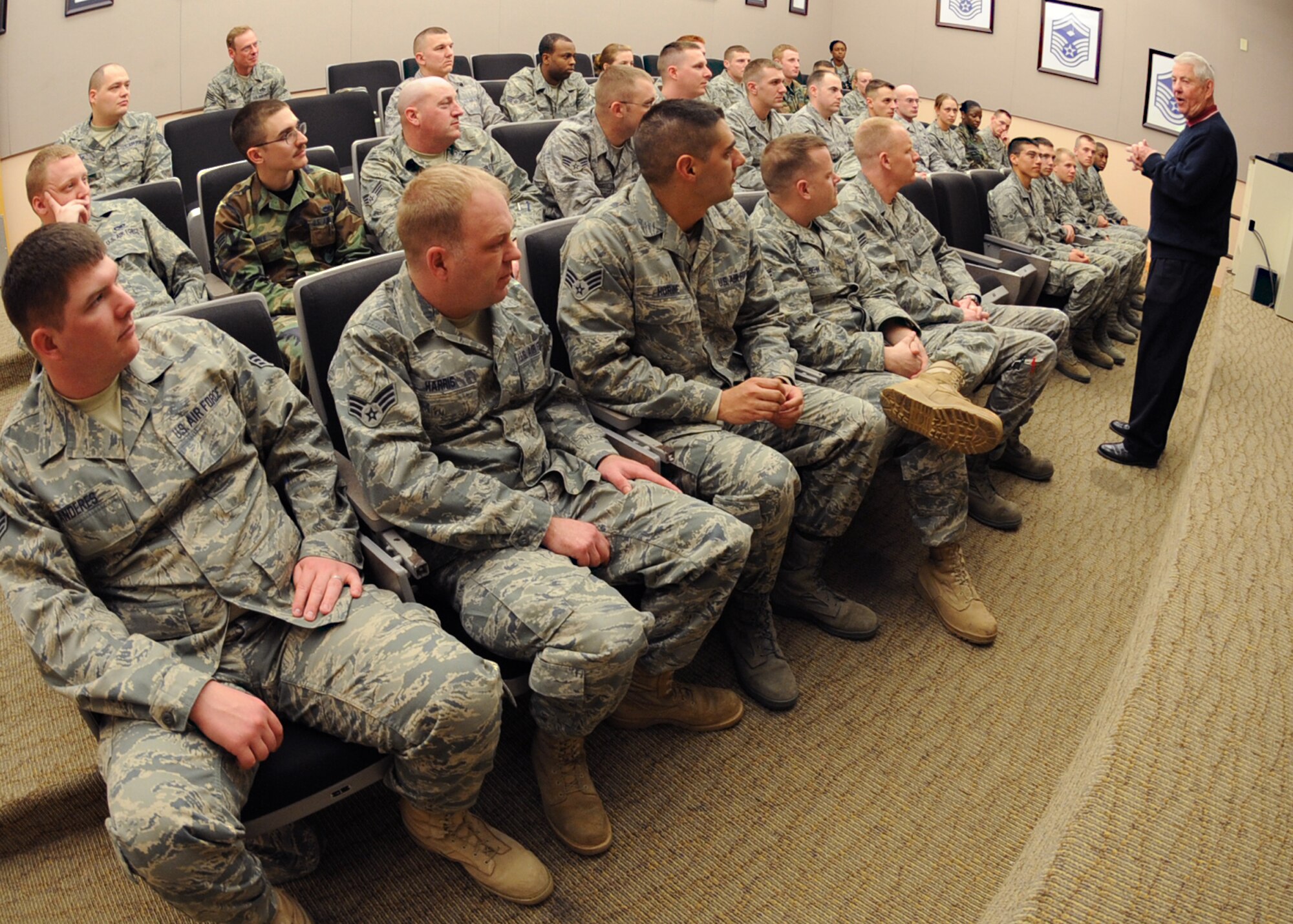 Retired Chief Master Sergeant of the Air Force Robert Gaylor speaks to 25 Airmen Leadership School students and five First Term Airmen during his visit, March 25, 2010, McConnell Air Force Base, Kan. Chief Gaylor shared personal stories and military experiences to aid Airmen with of future decisions, fitness, financial stability and education. (U.S. Air Force Photo/Senior Airman Maria Ruiz) 