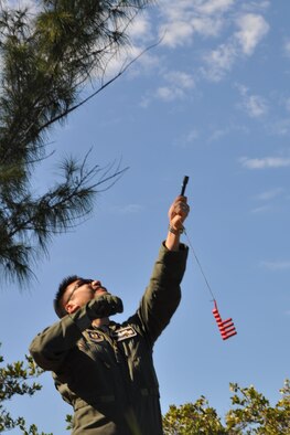 NAVAL AIR STATION KEY WEST, Fla. -- Air Force Reserve Major Issac Oh, a pilot assigned to the 773rd Airlift Squadron, watches as a flare he just launched from a small pen-like launcher ignites in the sky high above him during a survival training course held here, February 21-22. Major Oh and a group of Citizen Airmen from the 910th Airlift Wing, based at Youngstown Air Reserve Station, Ohio attended the course, conducted by Air Force Reservists assigned to the 439th Operational Support Squadron, to fulifill their annual requirement to refresh the skills needed in case their aircraft would go down over land or water. The coursework included segments covering map reading, compass use, food and water procurement, survival vest use, signaling devices and water survival training. U.S. Air Force photo by Master Sgt. Bob Barko Jr.