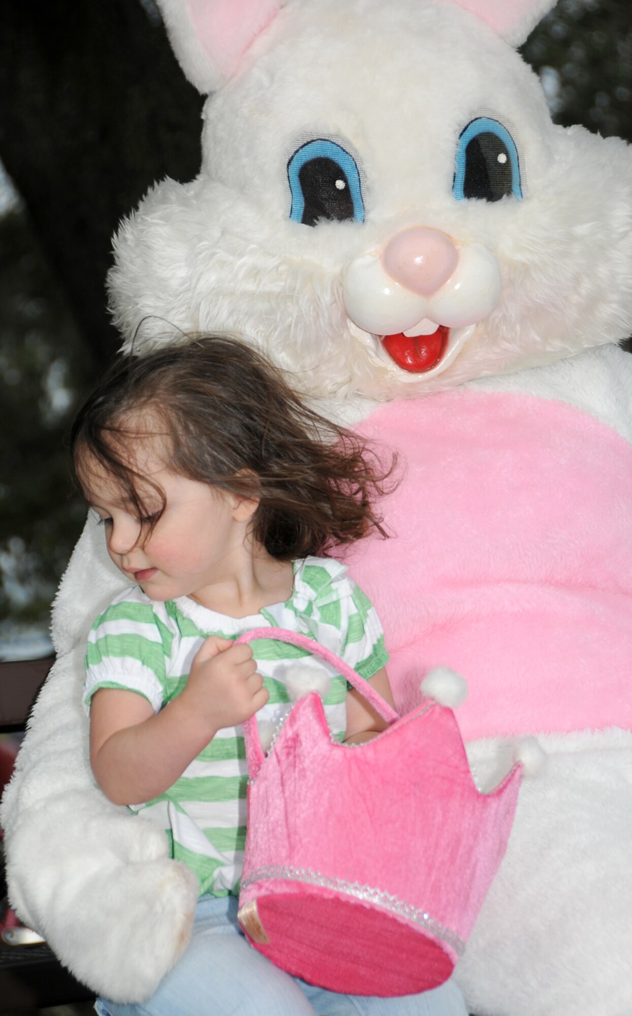 Skyler Castilleja, 2, sits on the Easter Bunny’s lap for a picture.  Her parents are Staff Sgt. Krystal Foster, 81st Diagnostics and Therapeutics Squadron, and Senior Airman John Castilleja, 81st Surgical Operations Squadron.  (U.S. Air Force photo by Kemberly Groue)