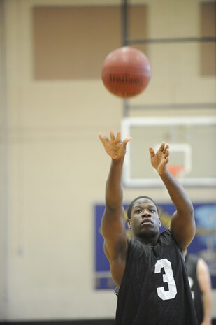 Will Johnson shoots a free throw during an intramural basketball game held at the Fitness and Sports Center March 30, 2010, at Joint Base Charleston, S.C. The 628th Force Support Squadron beat the 437th Aerial Port Squadron 44-37. Johnson is with the 437 APS. (U.S. Air Force photo/James M. Bowman)