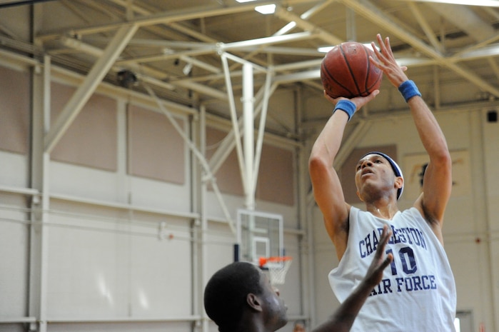 Laquinn Mims makes a jump shot during the intramural basketball game held at the Fitness and Sports Center March 30, 2010, at Joint Base Charleston, S.C. The 628th Force Support Squadron beat the 437th Aerial Port Squadron 44-37. Mims is with the 628 FSS. (U.S. Air Force photo/James M. Bowman)