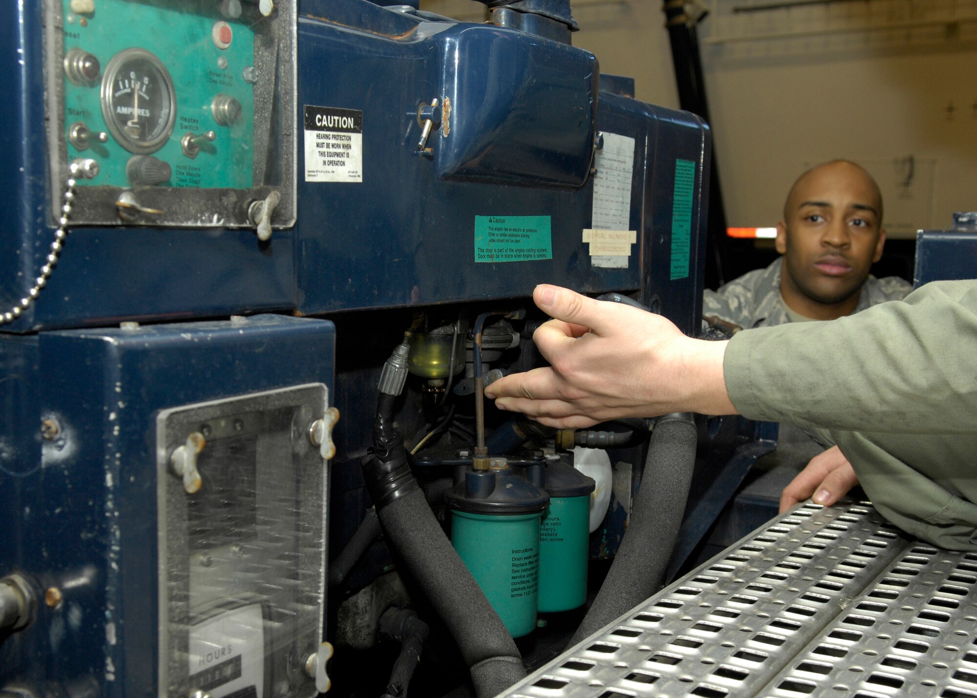VANDENBERG AIR FORCE BASE, Calif. -- Revving the engine of the auxiliary power unit, Staff Sgt. Anthony Klatt, of the 576th Flight Test Squadron, makes sure that it is in proper working order here Thursday, March 11, 2010. The APU gives enough power to aid in the cooling of a payload as it is being transported to the field and placed into the missile well. (U.S. Air Force photo/Airman 1st Class Lael Huss)