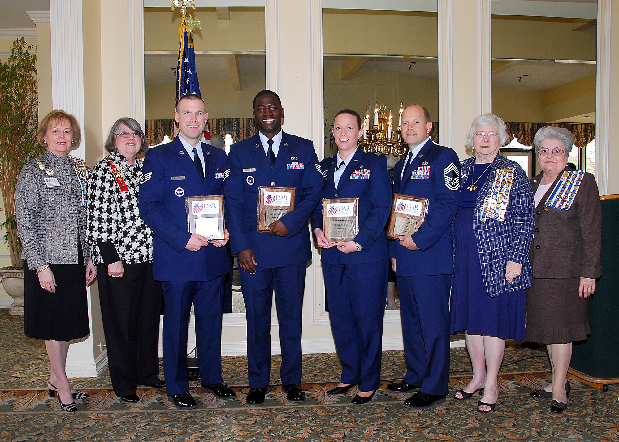 Four Airmen from Sheppard Air Force Base, Texas, received the Daughters of the American Revolution Award during the DAR Technical Training awards luncheon, at the Country Club in Wichita Falls, Texas, March 27. Pictured from left to right are Sharon Allen, DAR past state recording secretary; Rose Shackle Van Meter, DAR regent of the Maj. Francis Grice Chapter; Staff Sgt. Allan Habel, 82nd Training Group; Staff Sgt. Joseph Lockhart, Jr., 782nd TRG; Capt. Jennifer McCoy, 882nd TRG; Chief Master Sgt. David Hafner, 982nd TRG; Susan Shelton McRae, DAR state military awards chairperson for Sheppard AFB; and Margaret Williams Jones, state DAR registrar. Chief Hafner accepted the award on behalf of Staff Sgt. Paul Green, 372nd TRS Detachment 8. (U.S. Air Force photo/Harry Tonemah)