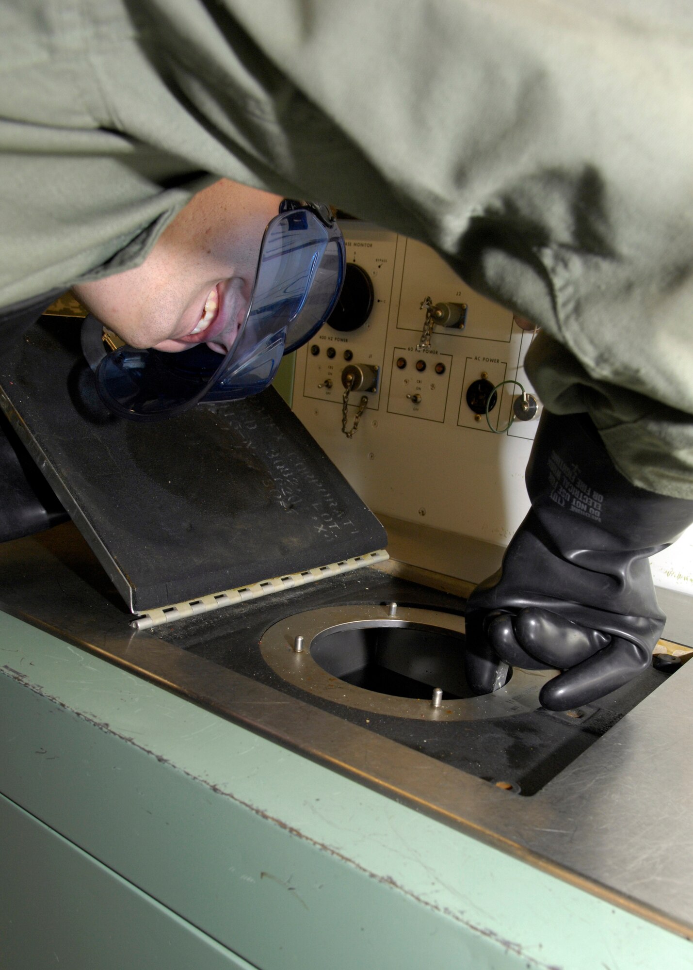 VANDENBERG AIR FORCE BASE, Calif. -- "The water level's good," said Staff Sgt. Anthony Klatt, of the 576th Flight Test Squadron, while checking the water level in the guidance and control test bench here Thursday, March 11, 2010. The GNC test bench is a piece of equipment used to judge the environmental controls on specific parts of a missile unit and must be checked before and after use. (U.S. Air Force photo/Airman 1st Class Lael Huss)