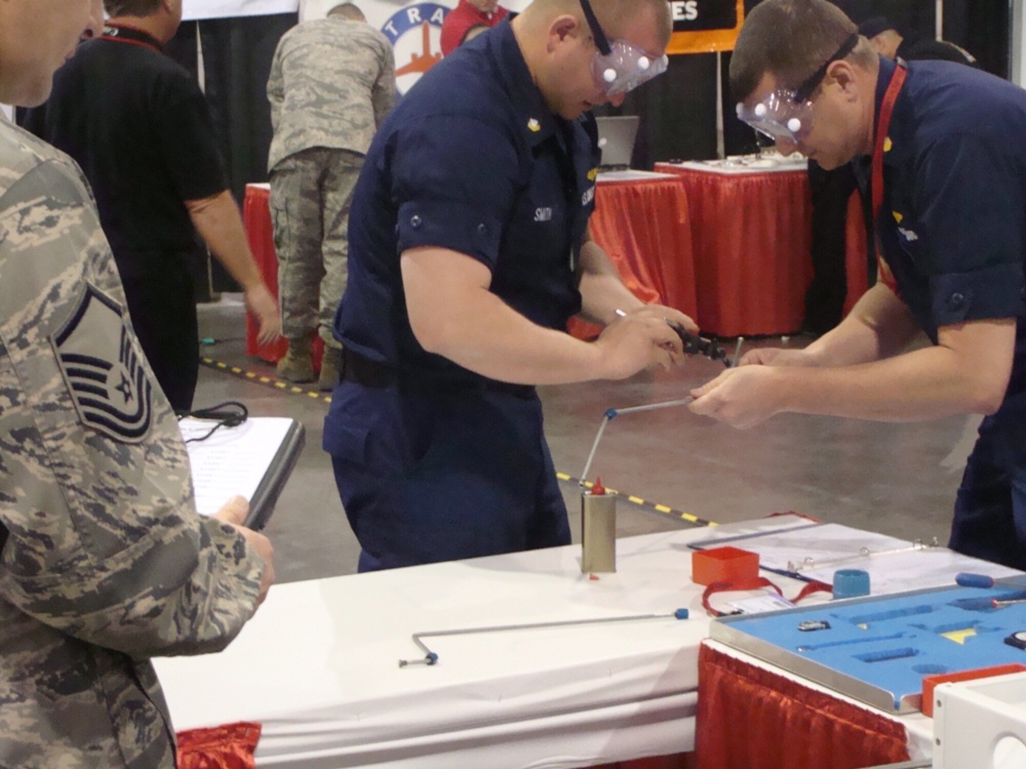 U.S. Coast Guard maintenance team members go to work on the rigid line troubleshooting event, designed by McChord Field Airmen and sponosored by the U.S. Air Force. (Courtesy photo)