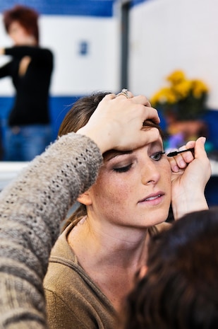 Amy Carter, an Air Force wife, receives a beauty makeover by a Stella Nova beautician March 27, 2010, at Armory Park in North Charleston, S.C. Stella Nova hair and makeup artists pampered military wives as part of ?Makeovers for Military Wives,? an event hosted by The Look for Success non-profit group. Mrs. Carter?s husband is preparing to deploy to Afghanistan this summer. (U.S. Navy photo/Mass Communicator 3rd Class Juan Pinalez)