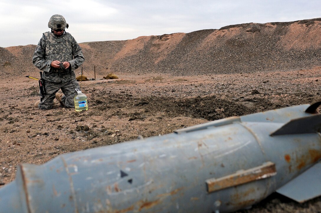 ELLSWORTH AIR FORCE BASE, S.D. -- Staff Sgt. Darryl Wilcken, 28th Civil Engineer Squadron explosive ordnance disposal journeyman, prepares detonation cord for a ring-line explosion during a routine training exercise, March 30. Sergeant Wilcken is participating in training that will prepare him for real-world situations. (U.S. Air Force photo/Airman 1st Class Matthew Flynn)