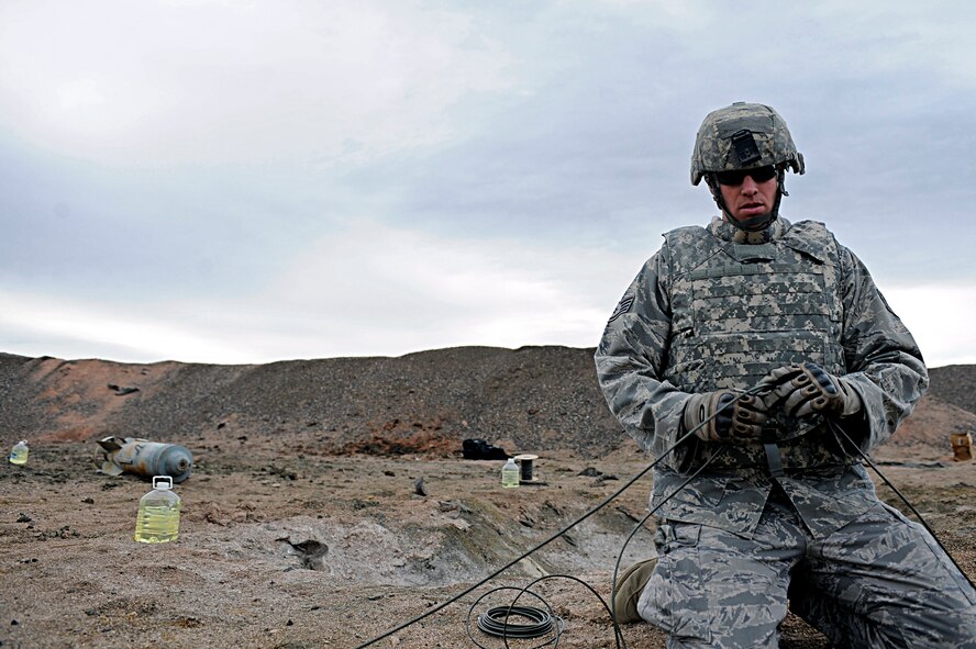 ELLSWORTH AIR FORCE BASE, S.D. -- Staff Sgt. Patrick Heltne, 28th Civil Engineer Squadron explosive ordnance disposal journeyman, prepares detonation cord for a ring-line explosion. Sergeant Heltne is participating in training that will prepare him for real-world situations. (U.S. Air Force photo/Airman 1st Class Matthew Flynn)