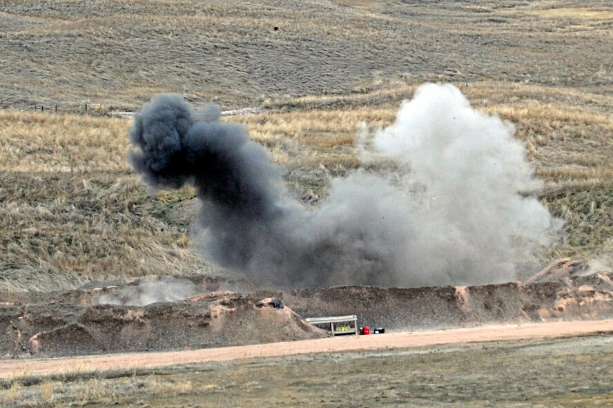 ELLSWORTH AIR FORCE BASE, S.D. -- A controlled explosion takes place at the bomb range during a routine training exercise by explosive ordnance disposal personnel, March 30. The training consisted of multiple controlled explosions to maintain combat readiness. (U.S. Air Force photo/Airman 1st Class Matthew Flynn)