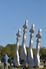 A composite flight of T-1, T-6, T-38, and T-43 aircraft fly over the Missing Man Monument at Randolph Air Force Base, TX, March 28. They are part of the fly over in support of the Freedom Flyer Reunion of former POW's. (U.S. Air Force photo by Steve White)